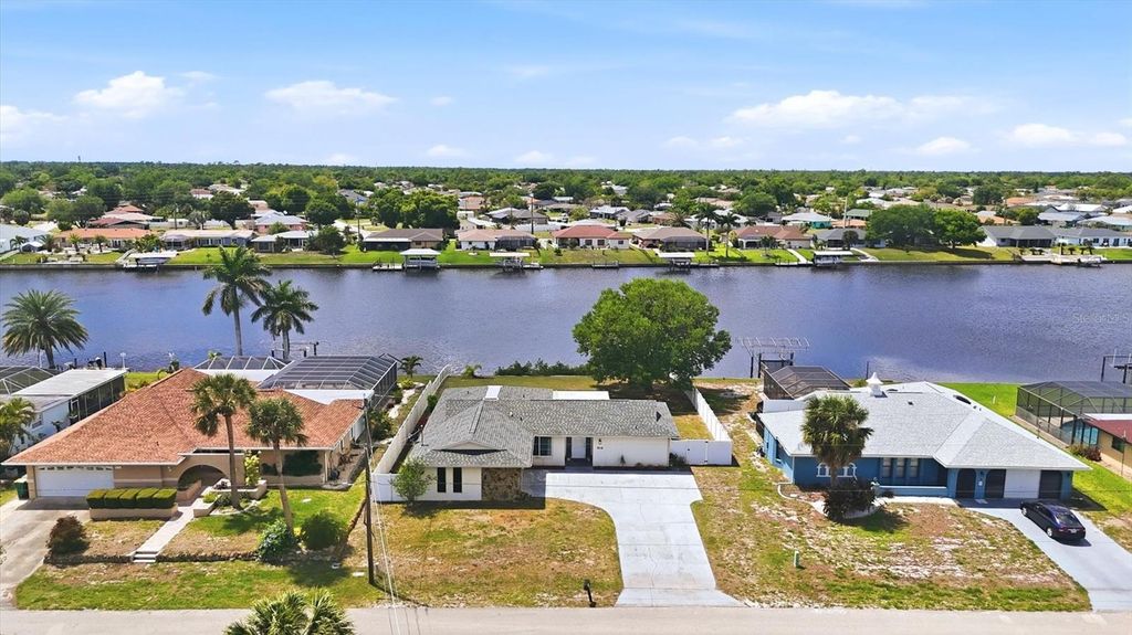 Photo of 814 Ellicott Circle NW, Port Charlotte, FL 33952 (MLS # A4688491)