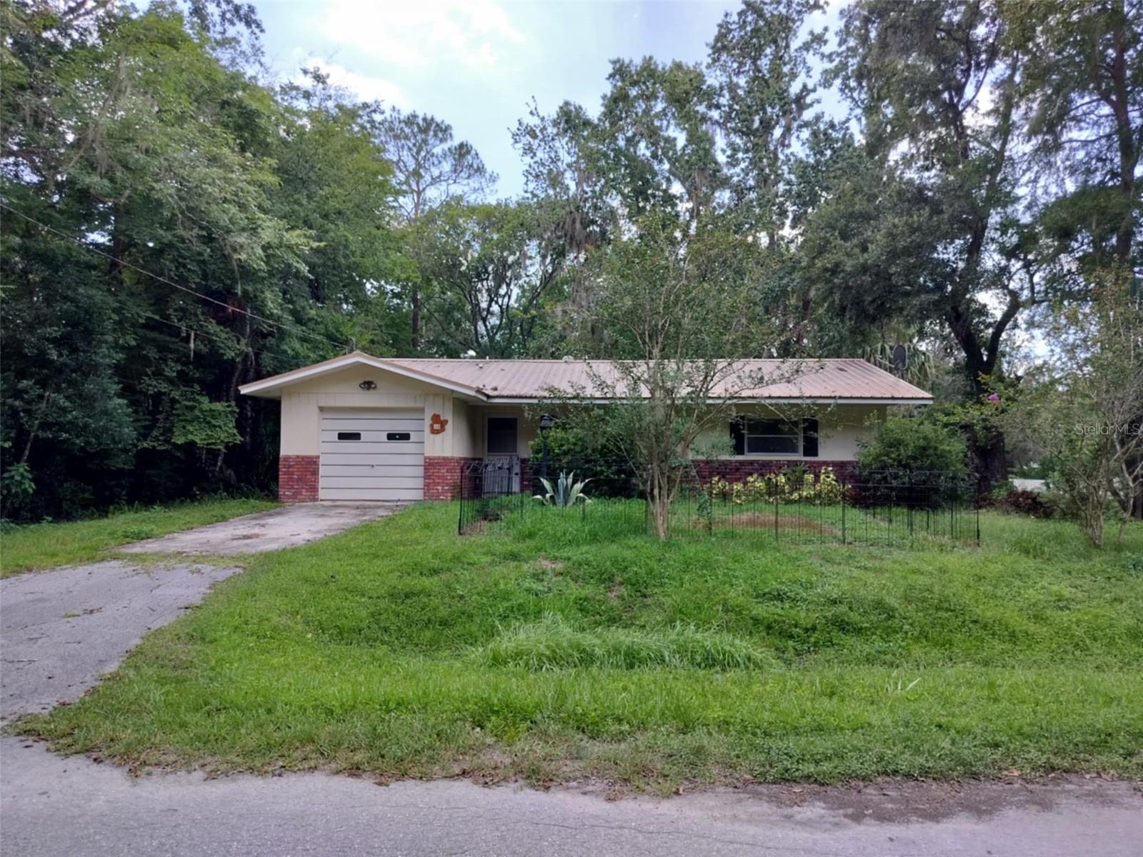 Welcome to your peaceful retreat in the heart of Sherwood Forest! This well-maintained 2-bedroom, 1-bathroom home offers 1,076 sq ft of living space on a generous 0.35-acre lot with 93 feet of WATERFRONT along a tranquil river canal.
Built in 1973, the home features a METAL ROOF (2014) and HVAC (2017). The kitchen includes wood cabinetry, laminate countertops, a breakfast bar, and essential appliances such as a gas range, dishwasher, refrigerator, washer, dryer, and water filter.
Inside, you'll find ceramic tile flooring throughout, a cozy and functional layout, and a warm, inviting atmosphere. The 25' x 10' screened rear porch with a beam tongue & groove ceiling is great for relaxing, while the 30' x 10' covered front porch offers a welcoming space to enjoy the outdoors.
Additional features include:
Attached 1-car garage
Concrete driveway
Storage closet
Covered front entry
Mature landscaping
No HOA
Utilities: Well and Septic
Located just minutes from downtown Inverness, shopping, dining, and I-75, this home offers a blend of comfort, character, and convenience. Whether you're looking for a full-time residence or a weekend escape, this property offers a unique opportunity to enjoy Florida living with direct river access.
Convenient Location:
Downtown Inverness – 2.5 miles (approx. 6 minutes)
Citrus Memorial Hospital – 2.7 miles
Whispering Pines Park – 3.2 miles
Shopping – 3.5 miles
Inverness Middle & High Schools – 3.8 miles
Withlacoochee State Trail access – 2.2 miles
Tampa VA Hospital - 1hr 12 min
Gainsville VA Hospital -1hr 6 min
Tampa Airport -1hr 18 min
Orlando Airport 1hr 6min
World Equestrian Center - 51 min
