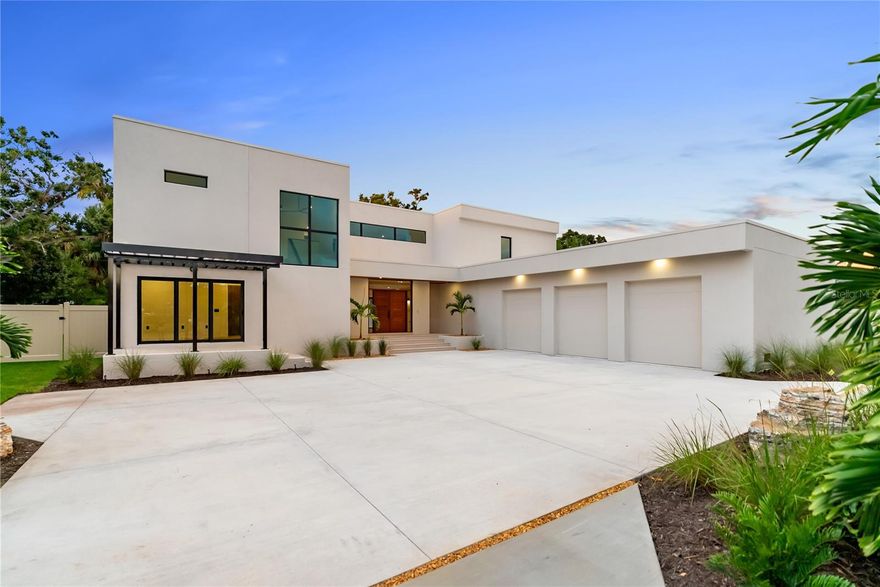 One or more photo(s) has been virtually staged. West of Trail luxury meets modern innovation at 1759 Waldemere Street. This brand-new, custom-built residence embodies timeless design, contemporary craftsmanship, and intentional indoor–outdoor living.

Set on a .33-acre lot just steps from Southside Village and Sarasota Memorial, the home delivers sophistication, convenience, and exceptional attention to detail in one of Sarasota’s most sought-after neighborhoods — a rare opportunity in the coveted West of Trail community.

Spanning 4,513 square feet, the two-story floor plan features four bedrooms, five baths, an office with private entry, and a media room that opens to a 480-square-foot balcony overlooking the property. Designed for both everyday living and elegant entertaining, the home showcases expansive sliding glass doors that blur the line between indoors and out, opening to a heated saltwater pool, spa, and lush landscaped backyard for year-round enjoyment.

The designer kitchen serves as the heart of the home, featuring Sub-Zero and Wolf appliances, custom cabinetry, imported stone, and a hidden butler’s pantry.

The first-floor primary suite epitomizes luxury with zero-corner sliders that open directly to the pool and outdoor living area. Inside, a spa-inspired bath includes a freestanding tub, walk-in shower, and a custom built-in walk-in closet.

Upstairs, two en suite bedrooms and a second-floor primary suite give privacy for family or guests. A versatile media room and expansive outdoor terrace complete the level, overlooking the serene backyard oasis.

Every detail has been thoughtfully curated — from the bespoke, locally handcrafted Sapele wood entry door to hurricane-impact windows and doors, a three-car garage with epoxy flooring, and professional landscaping surrounding the fenced backyard.

Ideally located in the highly regarded Southside Elementary School district, near Sarasota Memorial Hospital and the shops and dining of Southside Village, with downtown Sarasota, Siesta Key, Lido Key, and St. Armands Circle just minutes away.

This is more than a home — it’s a statement of Sarasota luxury living.