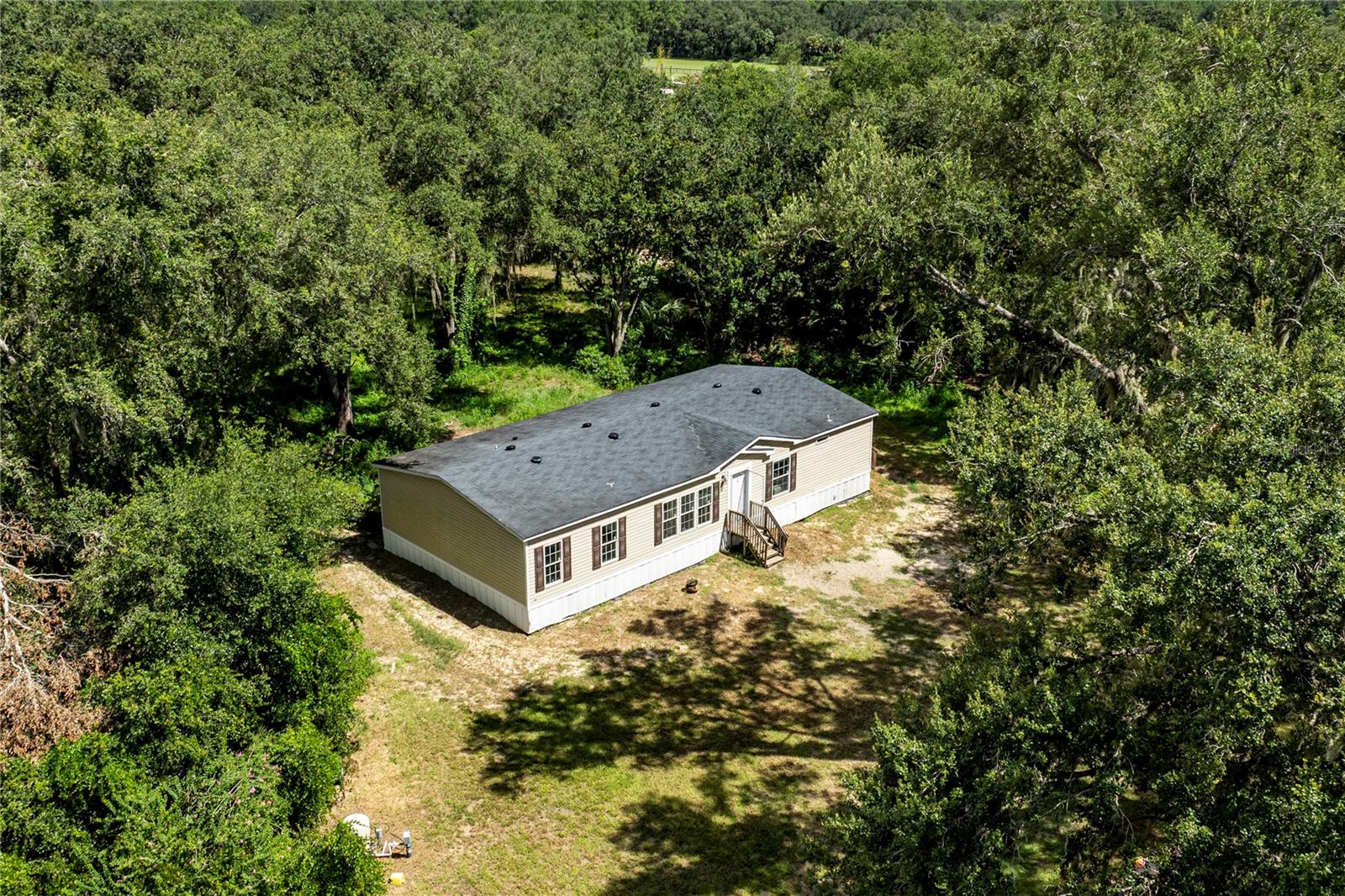 Surrounded by beautiful canopy oak trees and sitting on 2.38+/- acres this beauty is now available for its new family to enjoy. Built in 2020, this home offers 1920 square feet of living space with 4 bedrooms and 2 bathrooms. The open-concept kitchen, living room, and dining room create a spacious feel, perfect for family gatherings. The kitchen features ample storage and a generous island, ideal for meal prep and entertaining. All kitchen appliances are included. The primary bedroom is spacious and includes an en-suite bathroom with dual sinks, a stand-up shower, a garden tub, and a large walk-in closet. The three additional bedrooms have carpeted floors and sizable closets, and the guest bathroom is equipped with dual sinks and a bathtub. You'll also appreciate the oversized laundry room/mudroom, which provides excellent additional storage space (please note, the current freezer does not convey). This home is situated in a desirable location, offering both peace and quiet while remaining close to all amenities. Call today to schedule a private tour and experience all that this home and its expansive land have to offer. All information recorded in the MLS is intended to be accurate however, it should be independently verified by buyer and their agent. Entertaining all loan types; conventional, FHA, VA and USDA.