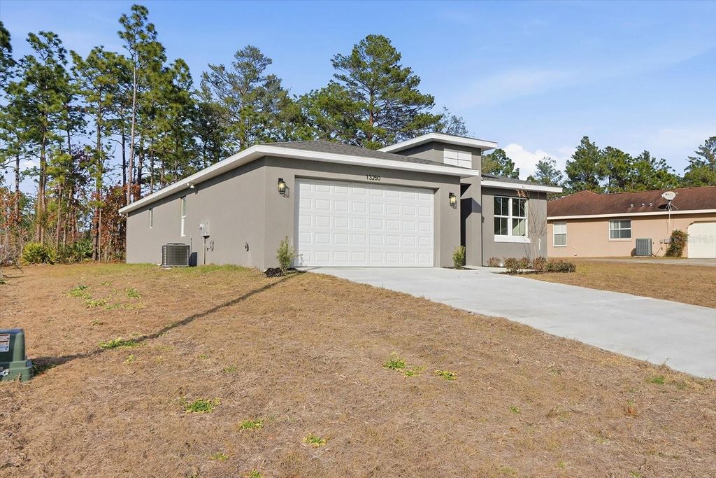 Photo of 13250 SW 79th Circle, Ocala, FL 34473 (MLS # O6376459)