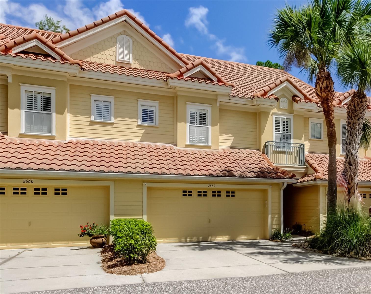 Welcome to this Impeccably maintained townhome offering 3 spacious bedrooms, 2 full baths + a powder room and a 2-car garage, ideally located just across the street from John Chestnut Park and the shores of Lake Tarpon. Tucked into a peaceful, well-kept community, this home blends comfort, style, and convenience. The chef’s kitchen features rich wood cabinetry, granite countertops, a pantry with pull-out shelves, and high-end GE appliances (2018). The open-concept living and dining areas lead to a private patio—ideal for relaxing or entertaining. Plantation shutters throughout add timeless style and light control. Upstairs, the oversized primary suite is a true retreat, complete with its own fireplace, private balcony, large walk-in closet, and en suite bath featuring a luxurious jetted garden tub and separate shower. Two additional bedrooms are generously sized and include charming window seats; one offers direct access to the second full bath. A bonus loft space provides the perfect setting for a home office, study area, or reading nook. For added convenience, the laundry room is located on the second floor. Additional features include a newer A/C system (2021) and a spacious 2-car garage. Enjoy easy access to shopping, top-rated golf courses, and world-class Gulf Coast beaches—all just a short drive away. This move-in-ready townhome offers a rare combination of space, location, and low-maintenance living. Don’t miss it!