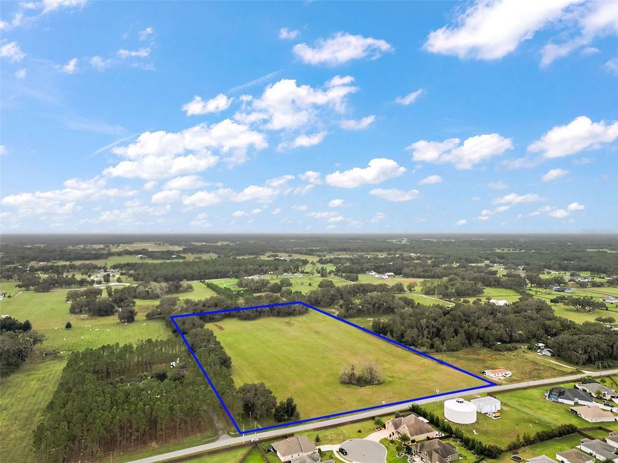 This stunning 16.36-acre property is situated just outside The Villages, the nation's largest 55+ community, in Sumter County. Sumter County ranks as one of Florida's most rapidly expanding counties, with considerable residential and commercial growth in recent years. City of Wildwood water and sewer utilities run past the property on CR 214. The site is all uplands, not located within the Flood Hazard Area and has 611 feet of frontage on Sumter County Road 214.  Adjacent properties are zoned R-2, allowing up to 6 residential units per acre, making this an ideal site for a future residential development, your dream home, or a great investment in an area with rapid growth. the property is in an area with convenient access to Hwy 301, the Florida Turnpike, and I-75.