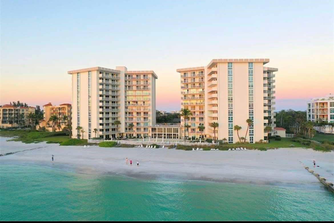 RARELY AVAILABLE! This absolutely gorgeous fully furnished 2BR/2BA Condo at Islander Club – Just steps from the Beach!
Start living the island lifestyle in this beautifully updated, furnished 2-bedroom, 2-bath condo at the Islander Club on South Longboat Key! This turnkey rental is ready for immediate enjoyment—just bring your suitcase.
Enjoy a bright, open layout with floor-to-ceiling hurricane impact windows and a spacious 38-ft garden terrace—perfect for soaking up morning sunrises and relaxing with tropical breezes. The updated kitchen features granite countertops, plenty of storage, and flows seamlessly into the living room—ideal for relaxing or entertaining.
The primary suite includes a walk-in closet, en-suite bath, and sliding doors opening to the terrace—fall asleep to the sound of waves! The guest bedroom also offers terrace access and garden views. Both bathrooms are updated with granite counters and modern glass showers. In-unit washer included.
Resort-style amenities include a beachfront Jr. Olympic pool, fitness center, clubhouse, library, game room, and direct beach access. On-site management and secure entry add peace of mind.
Located across the street from the Avenue of the Flowers shopping center (Publix, CVS, Post Office) and just a short drive to St. Armands Circle and Downtown Sarasota with shopping, dining, and arts.