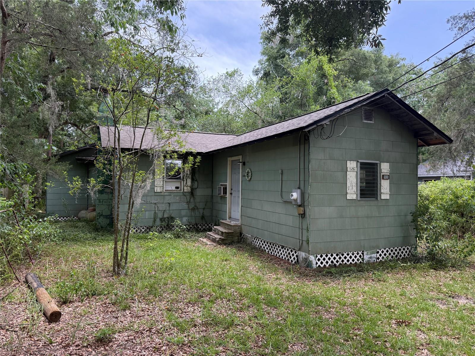 Welcome to this handyman special, a hidden gem ready for transformation in the highly sought-after NW Gainesville area. While the property does require repairs, it presents a unique opportunity for savvy investors looking for a rewarding project with significant potential. This home offers the perfect canvas for renovation, restoration, and reimagining. Situated on a double lot, the property provides added flexibility. However, if the purchaser intends to pursue a lot split, consultation with a civil engineer during the inspection period will be necessary.
