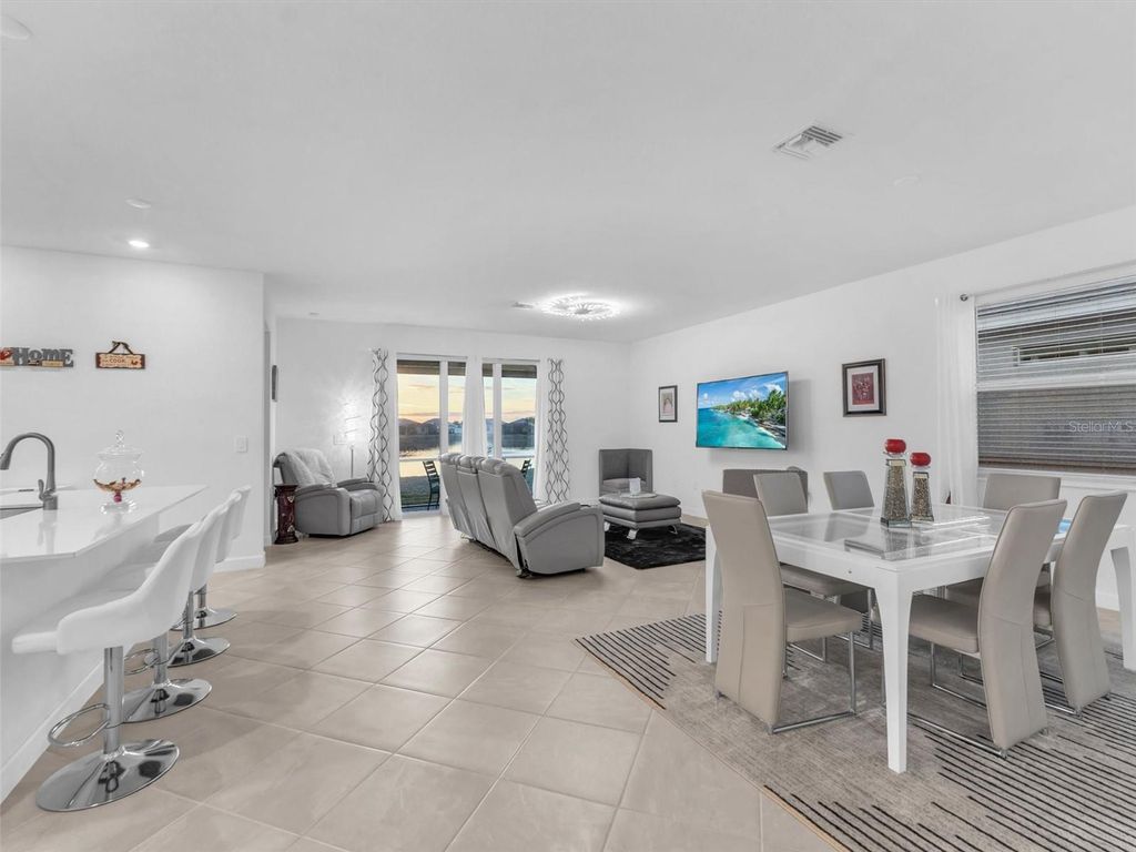 Photo of 7973 Lakes Edge Lane, Port Charlotte, FL 33981 (MLS # O6374999)