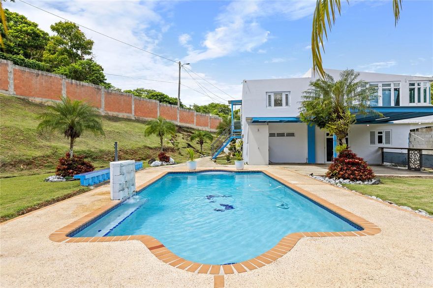 Investors and Large Families – High-Income Opportunity with Private Pool in Gurabo!
This nearly one-acre property in a serene, private community features a private pool, BBQ area, outdoor bathroom, 4-car garage, fully fenced grounds, and a main house for the owner. Currently generating strong income through short-term rentals, it comfortably accommodates up to 10 guests. With a spacious patio, power generator, and water cistern, this home is turnkey ready for maximum rental potential. Don’t miss your chance to own a spacious, income-producing property in one of Gurabo’s most desirable neighborhoods—perfect for large families or savvy investors looking for immediate returns!