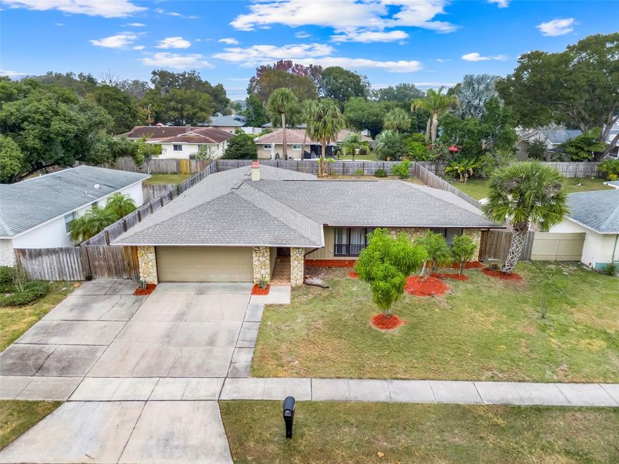 Looking for a home with NO HOA? This single-story, 4-bedroom, 2-bath pool home in Altamonte Springs may be exactly what you’ve been waiting for. The split floor plan offers both privacy and functionality, while a large stone, wood-burning fireplace anchors the family room and creates a warm, inviting focal point.  Both bathrooms provide convenient access to the screened rear patio, making indoor-outdoor living effortless. The primary suite features dual modern bowl sinks, an upgraded tile shower, and updated flooring. Step outside to enjoy the screened pool and patio, complete with an oversized concrete deck.  Perfect for entertaining, additional parking, or relaxing Florida-style living.  A definite must-see!  Schedule your showing today.