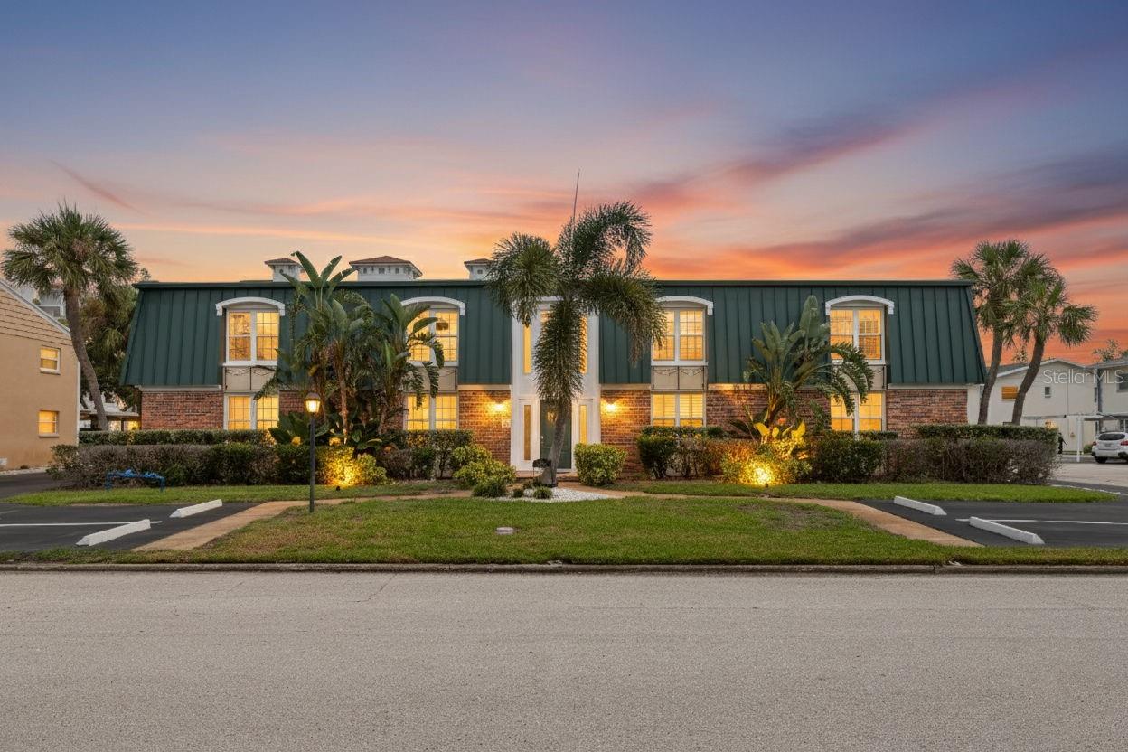 Experience refined living on Snell Isle, one of St. Petersburg’s most beautiful neighborhoods. Just minutes from the vibrant energy of downtown, this exclusive residence offers the perfect balance of tranquility and convenience, without any history of flooding. This rare first-floor corner unit provides a private setting enhanced by thoughtful design and high-end finishes throughout. Step inside to a spacious open floor plan adorned with chiseled edge limestone flooring and illuminated by natural light streaming through hurricane-impact windows, creating both elegance and peace of mind. The large living room flows seamlessly into the dining area and chef-inspired kitchen. Designed for entertaining, the kitchen features a generous island with storage, granite countertops, GE Whirlpool appliances, an abundance of custom cabinetry, and a reverse osmosis water filtration system. A walk-in butler’s pantry with built-in cabinetry and a wine refrigerator further elevates the space. Retreat to the expansive owner’s suite, complete with a walk-in closet and spa-like ensuite boasting a jetted soaking tub. The guest suite offers two closets and a full bathroom with a walk-in shower, ensuring comfort for family and friends. A dedicated office/den, walk-in storage room, and laundry room provide both flexibility and convenience. French doors open to your private patio, the ideal spot to enjoy morning coffee or evening cocktails. Additional exterior features include an assigned covered parking space directly behind the home, guest parking, and a shared storage unit. Residents of Snell Isle enjoy proximity to the Snell Isle Marina, the Vinoy Golf Club and Clubhouse, as well as the boutiques, dining, and cultural experiences of downtown St. Petersburg. With grocery stores nearby, beaches a short drive away, and Tampa International Airport easily accessible, every convenience is within reach. This home is more than a residence, it’s a lifestyle.
