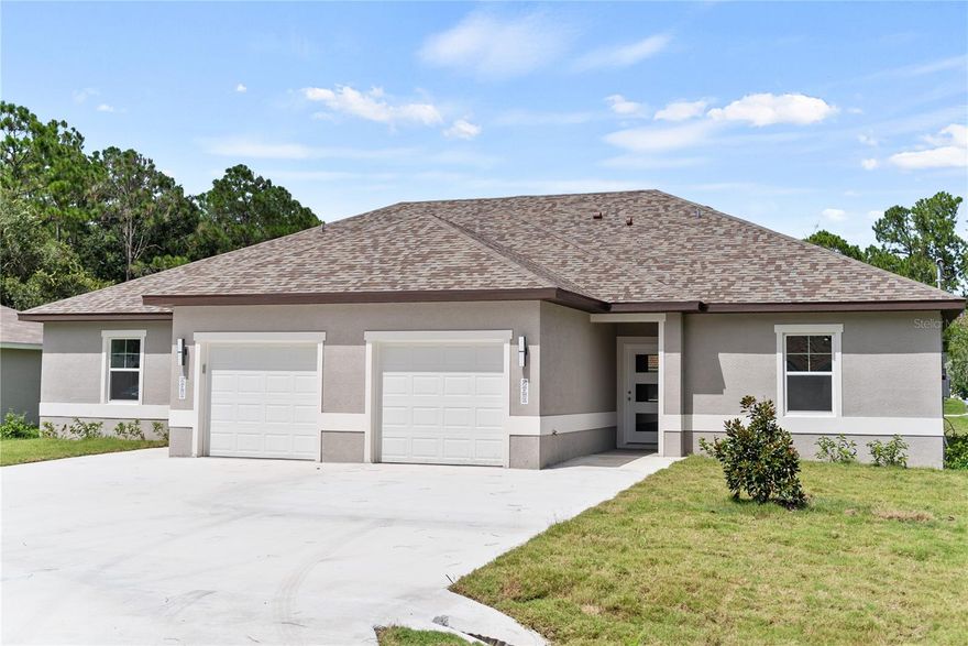 This 1-year-old, 1200sqft 3-bedroom, 2-bathroom, 1-car garage duplex unit is located in Pine Lakes Subdivision. Crafted with meticulous attention to detail by the builder, this property offers a unique blend of comfort and style. The kitchen features stainless steel energy-efficient appliances, elegant granite countertops, and 42-inch cabinets. The master shower and guest bath are adorned with tile that extends all the way to the ceiling, adding a touch of sophistication to your daily routine. The house boasts waterproof, scratchproof luxury vinyl planks throughout, combining beauty and durability to withstand the test of time. Each bedroom is equipped with ceiling fans featuring built-in lighting. Great location in the heart of the city, you won't be too far from necessities. Bike, walk, or stroll along the 4-mile walking sidewalk with benches. In less than 15 minutes in the car, you'll be on the beautiful shore of Flagler Beach. Only 30 minutes north of historic downtown St. Augustine or 30 minutes south at The World's Most Famous Daytona Beach