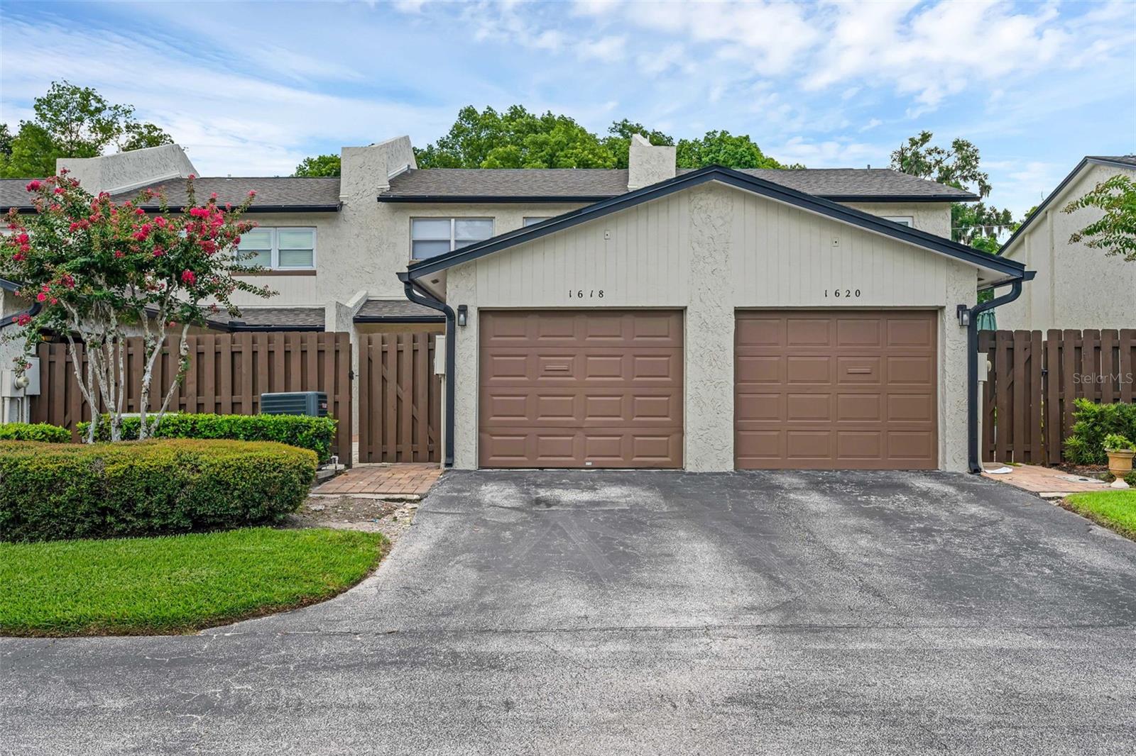One or more photo(s) has been virtually staged. Welcome to this exquisitely renovated home offering the best value in the maintenance-free community of Park Lake Grove! This stunning 3-bedroom, 3-bathroom property features 1,328 square feet of beautifully updated living space and a rear-facing, fully enclosed one-car garage. Every inch of this home has been thoughtfully renovated with quality and style in mind. Step into the gorgeous NEW kitchen featuring custom NEW cabinetry, sleek granite countertops, and a full set of brand-NEW stainless steel appliances, making it as functional as it is beautiful. The kitchen flows seamlessly into the living space, where premium luxury laminate flooring offers a sophisticated look with superior durability and comfort. The main level includes a convenient guest room with sliding doors that opens to a private, tiled courtyard with a quaint garden area—perfect for relaxing or entertaining and a fully renovated bathroom . No front-facing neighbors provide enhanced privacy while enjoying the serene front patio and upstairs balcony, offering peaceful wooded views. Upstairs, you’ll find TWO oversized PRIMARY SUITES EACH WITH IT'S PRIVATE BATHROOM, each designed as a personal retreat. The front-facing suite features a private balcony, ideal for morning coffee or unwinding in the evenings. Additional highlights include: Brand New tankless water heater, New AC system, New washer and dryer included in a spacious laundry room with ample storage, Fresh interior paint, fully renovated kitchen and bathrooms! Located in the highly desirable Park Lake Grove community in Maitland, close to Winter Park's best dining, shopping, and cultural attractions. The HOA includes exterior building maintenance, landscaping, a community pool, and access to a private dock on Park Lake—perfect for relaxing by the water. This is truly a move-in-ready home offering worry-free homeownership and luxury living in one of Central Florida’s most sought-after areas. Don’t miss out—schedule your private showing today!
