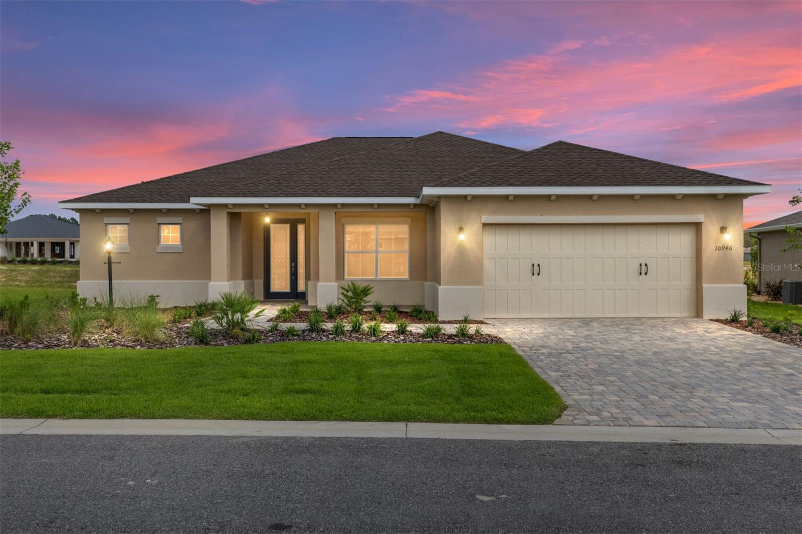 Welcome to the Livingston Model, a stunning new construction home in LongLeaf Ridge at On Top of the World, Ocala’s premier 55+ active adult community. This beautifully designed home offers 2 bedrooms, 2 bathrooms, an oversized 2-car garage with golf cart parking, and a flex room with French doors—perfect for a home office or hobby space. The home also features a paver driveway and walkway and wood-like tile flooring throughout for both style and durability. The living area boasts a tray ceiling and flows seamlessly through a 3-panel sliding glass door to the screened lanai, creating an inviting indoor-outdoor lifestyle. The gourmet kitchen features brown staggered cabinetry with crown molding, under-cabinet lighting, quartz countertops, stainless steel appliances, a pantry, and a spacious island, ideal for cooking and entertaining. The adjacent dining area, highlighted by a chandelier and three floor-to-ceiling windows, offers beautiful backyard views. The guest bedroom includes two windows with blinds and a closet, conveniently located next to the guest bathroom with a tiled tub/shower combination and single quartz vanity. The primary suite is a private retreat with a tray ceiling, two windows overlooking the backyard, a generous walk-in closet, and a spa-inspired en suite featuring double vanity sinks with quartz countertops, a linen closet, and a zero-entry tiled shower with built-in bench. With its elegant finishes, open layout, and access to world-class amenities in a gated, golf cart-friendly community, the Livingston model perfectly blends luxury and comfort. Schedule your private showing today and experience why so many choose to call On Top of the World home!