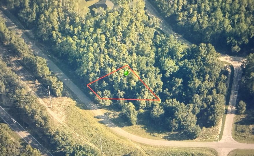 This spacious 0.32-acre lot offers a prime opportunity to build your dream home plus a guest house. Located in a highly strategic and expanding area, this property features direct access to water, electricity, and all utilities—fully ready for construction. Situated on paved roads within a planned residential community, this lot provides an excellent balance of privacy, accessibility, and long-term value. No HOA, no mobile homes allowed, and only site-built homes with a minimum of 1,000 sq ft permitted. Well suited for builders, investors, or buyers looking for a solid land opportunity in one of Florida’s most promising markets. Build smart. Invest wisely.