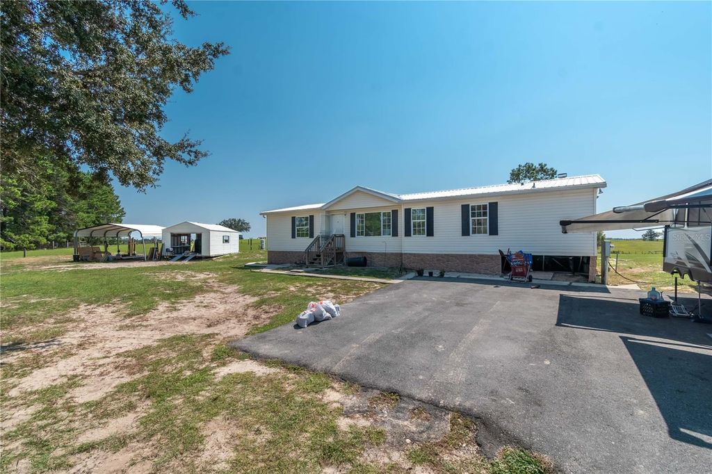 Photo of 2061 NW 165th Court Road, Dunnellon, FL 34432 (MLS # TB8428048)