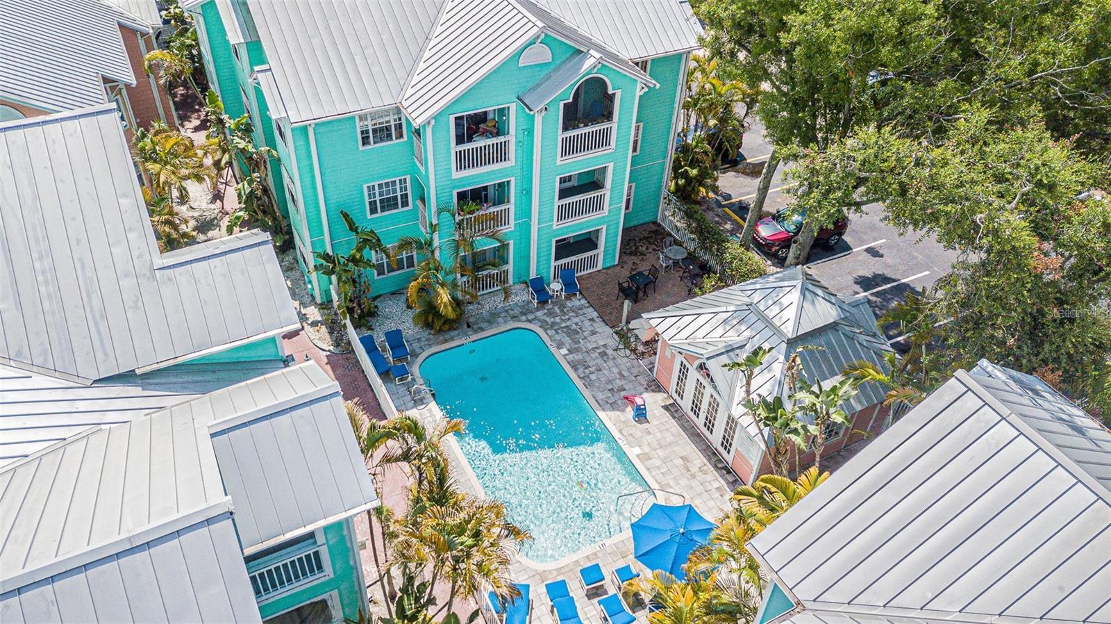Live in the vibrant heart of South Tampa’s coveted SoHo district—just steps from popular shops, restaurants, and the iconic Bayshore Boulevard! This bright and inviting 2-bedroom, 2-bath condo is perfectly positioned on the second floor of the charming Key West-style community of Mallory Square. Inside, you’ll find a light-filled open layout with large windows, neutral tones, and laminate flooring in the main living areas. A sliding glass door leads to your own private patio—ideal for morning coffee or evening wind-downs. The cozy kitchen offers everything you need, including a range, built-in microwave, dishwasher, and breakfast bar for casual dining. The spacious primary suite features a large closet and ensuite bath with a walk-in shower. The secondary bedroom is equally bright and offers ample space for guests, a home office, or roommates. Enjoy maintenance-free living with resort-style amenities including a beautifully landscaped pool area—perfect for relaxing or socializing with friendly neighbors. Zoned for top-rated schools (Mitchell / Wilson / Plant), and just minutes to Hyde Park Village, Downtown Tampa, MacDill AFB, parks, and I-275, this location offers unbeatable convenience and lifestyle.