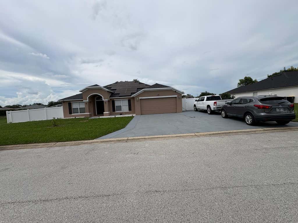 Photo of 645 Hatchwood Drive, Haines City, FL 33844 (MLS # O6432036)