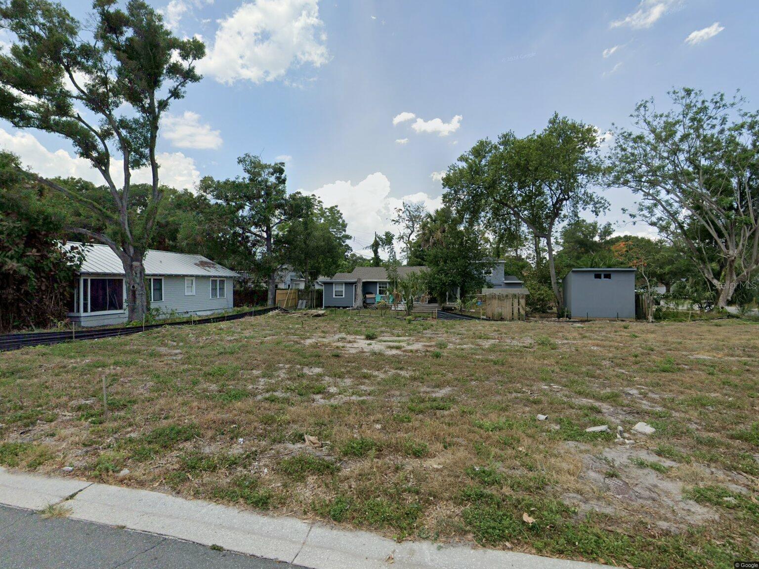 NEW PRICE TO SELL!! Oversized corner lot (114’x65’) - scraped and with impact fees paid, potentially saving buyer ~$50k. Approved permit on hand to build a 4-bed, 4-bath, spec pool home with an ADU, pool, and 2-car garage. 2 PURCHASE OPTIONS: A - Take over the existing permit. Contractor on a permit can build at cost plus 20%. OPTION B - permit can be withdrawn, and the buyer can design and build their own dream home. High & Dry, no HOA.