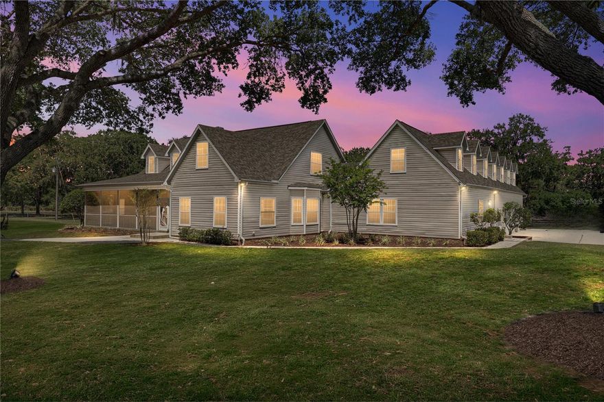 A true equestrian escape idyllically resting on nearly 43 acres in one of the few untouched areas of Dade City’s rolling hills. Three separate parcels combine together providing the opportunity for a family compound or sprawling farm life living. This 7 bedroom, 6.5 bath, 4 car garage pool home is accompanied by an expansive and well equipped 10 stall horse barn providing everything you need to move right in, bring your animals, and enjoy the surroundings. Mature landscaping and trees and a screened front porch overlooking the property offer a warm welcome. Inside, an expansive and flexible floor plan unfolds including a formal living and dining room, a family room, a well equipped chef's kitchen, a gym with a sauna, a laundry room/butlers pantry, and 7 generous bedrooms all perfectly placed throughout the residence. Head up to the second floor to discover a guest/in-law suite with a balcony overlooking the pool. Located on the opposite side of the master bedroom, this 2/2 suite has a spacious living room and kitchen area, and it could be closed off creating a separate entrance with a direct to the outside door located by the gym. The outdoor entertaining space is second to none featuring a tropical pavered pool deck with covered seating, a bar/grilling area, a pool and spa with rock and waterfall features, there is even a basketball court! Parking is no issue with an oversized 4 car garage a long driveway, and a huge parking pad. Bring your horses and other agricultural animals! This property is built for luxury rural living. With several cross fenced pastures and a barn already set up offering 10 stalls, a full bathroom, an office, laundry, tack room, wash room, a 9’x115’ 2nd floor loft, and a center aisle with barn doors on both ends. This isn't just a house- this is the epitome of an Equestrian Paradise.