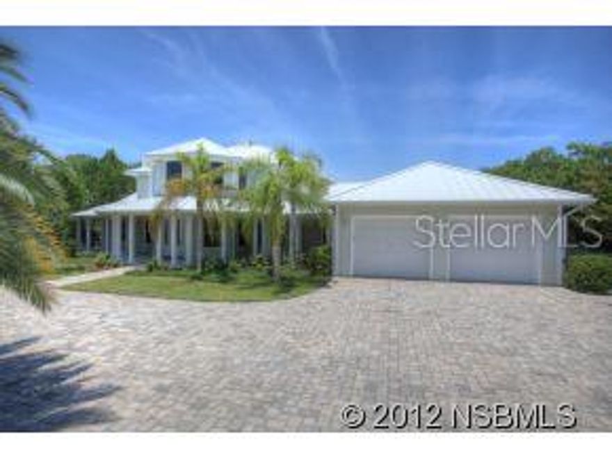 5 bed 5  bath gated riverfront estate seems park-like with over 1 acre of manicured tropical landscaping & 150ft of direct river frontage with seawall; truly 1 of a kind. Upon entering the home you are greeted by the impressive grand staircase, and the custom paddle ceiling fan above; both are centerpieces in their own right. Hardwood floors lead past the formal dining room, into an open floor plan family room & kitchen. The main living room & casual dining area is open and spacious & include marble gas fireplace, built-in entertainment center & adjacent alcove affords magnificent views of the intracoastal via 5 large bay windows. Gourmet kitchen is well designed in taste & efficiency; granite counter tops, triple-bowl sink & sleek stainless GE Monogram appliances. The kitchen connoisseur in your life will appreciate custom details like; double oven featuring GEs Advantium oven & large prep/bar island w/sink & ice fridge. Plentiful, spacious cabinets & custom walk-in pantry provide ample space for accessible storage. The large window floods the kitchen in natural light & also makes sunsets & sailboats the backdrop to your life. This home sits on the intracoastal & includes private boat dock & lift so life on the water has never been easier. Home also features; a free form pool & spa, beautifully pavered deck & driveway & wrap around porches. Large laundry room has custom cabinets, fold out ironing board, & hanging rack. Off the living room, the master suite features his & hers walk-in California closets, & private access to pool patio via French doors. Master bath is spa-like, complete with his & her sinks, oversized walk-in shower w/ triple shower heads & claw-foot bath tub. 3 guest bedrooms w/private baths & bonus room perfect for an office or 5th bedroom. 2 car attached garage plus 4 car detached perfect for a workshop or storing your toys.UNCOMPARABLE SUNSETS!!! ;Water: City