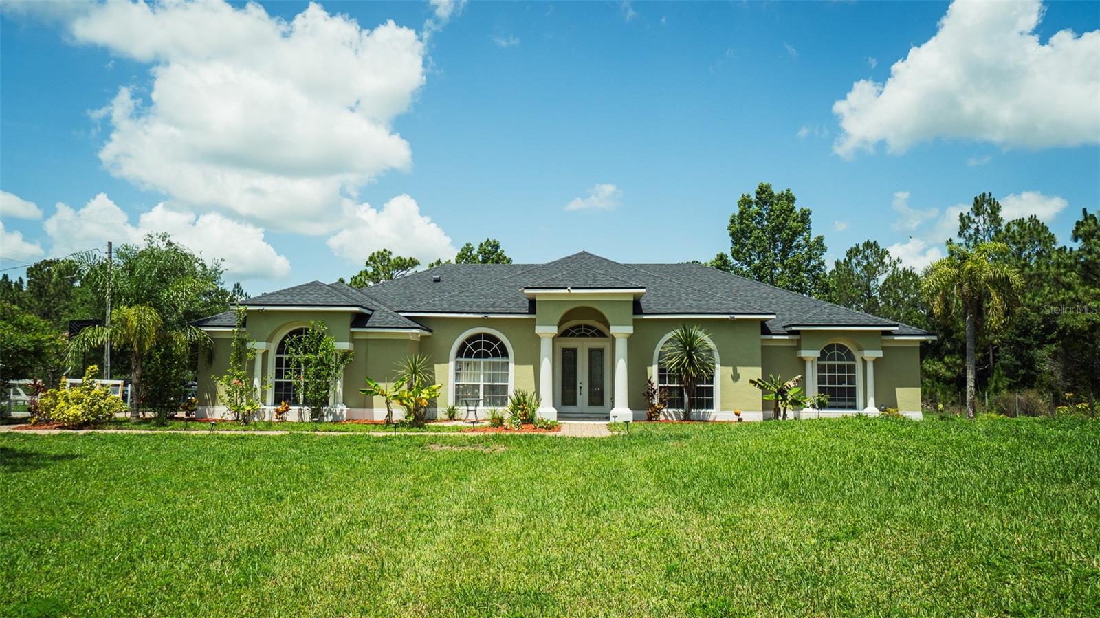 Spacious 4-bedroom, 3-bath pool home on over 2 acres of serene land! This unique rental offers resort-style living with a private screened-in pool, lush greenery, and plenty of room to roam. Bring your green thumb — there's a greenhouse ready for use, plus a charming chicken coop with chickens included for fresh eggs daily! Ideal for nature lovers, gardeners, or anyone seeking peaceful country living just 25 minutes from the beach. Generous living spaces, updated kitchen, and plenty of outdoor space make this the perfect retreat to call home.