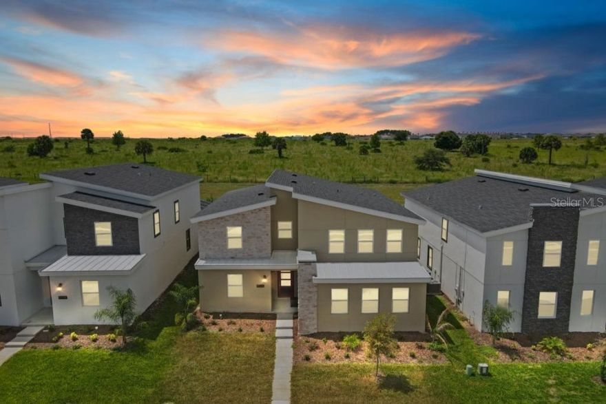 Experience exceptional luxury, comfort, and rental appeal with this beautifully designed 6-bedroom, 6-bathroom retreat located in one of Kissimmee’s most desirable resort communities. This stunning residence offers an impressive combination of space, style, and sophistication, making it an ideal choice for families, vacationers, and investors seeking a high-performing short-term rental property. From the moment you step inside, you’ll be greeted by a bright, open floor plan enhanced by premium finishes, thoughtful décor, and professionally curated furnishings that elevate the entire home. The gourmet kitchen is a true centerpiece, featuring sleek stone countertops, stainless steel appliances, a large island, and ample seating perfect for gatherings, meal prep, and entertaining with ease. The expansive living and dining areas are designed for both relaxation and connection, flowing seamlessly to the private screened-in pool area. Whether enjoying peaceful mornings by the water or hosting unforgettable evenings with guests, the outdoor space offers the ultimate Florida lifestyle. With six spacious bedrooms, including multiple beautifully styled en-suites, this home delivers exceptional comfort and flexibility for large groups. Each room has been uniquely decorated to create an engaging and memorable experience for guests, adding to the property’s desirability and strong rental performance. Every bathroom is elegantly finished, offering both convenience and luxury throughout the home. Residents and guests also enjoy full access to the resort’s world-class amenities from sparkling pools and recreation areas to fitness facilities, sports courts, and vibrant social spaces. Located just minutes from Disney World, Universal Studios, Orlando International Airport, top shopping destinations, dining, and entertainment, this home offers unbeatable convenience in the heart of Central Florida. Whether you're looking for a striking vacation home, a spacious family haven, or a turnkey income-producing investment, this exceptional property is move-in and rental ready offering unmatched value, design, and location from day one.