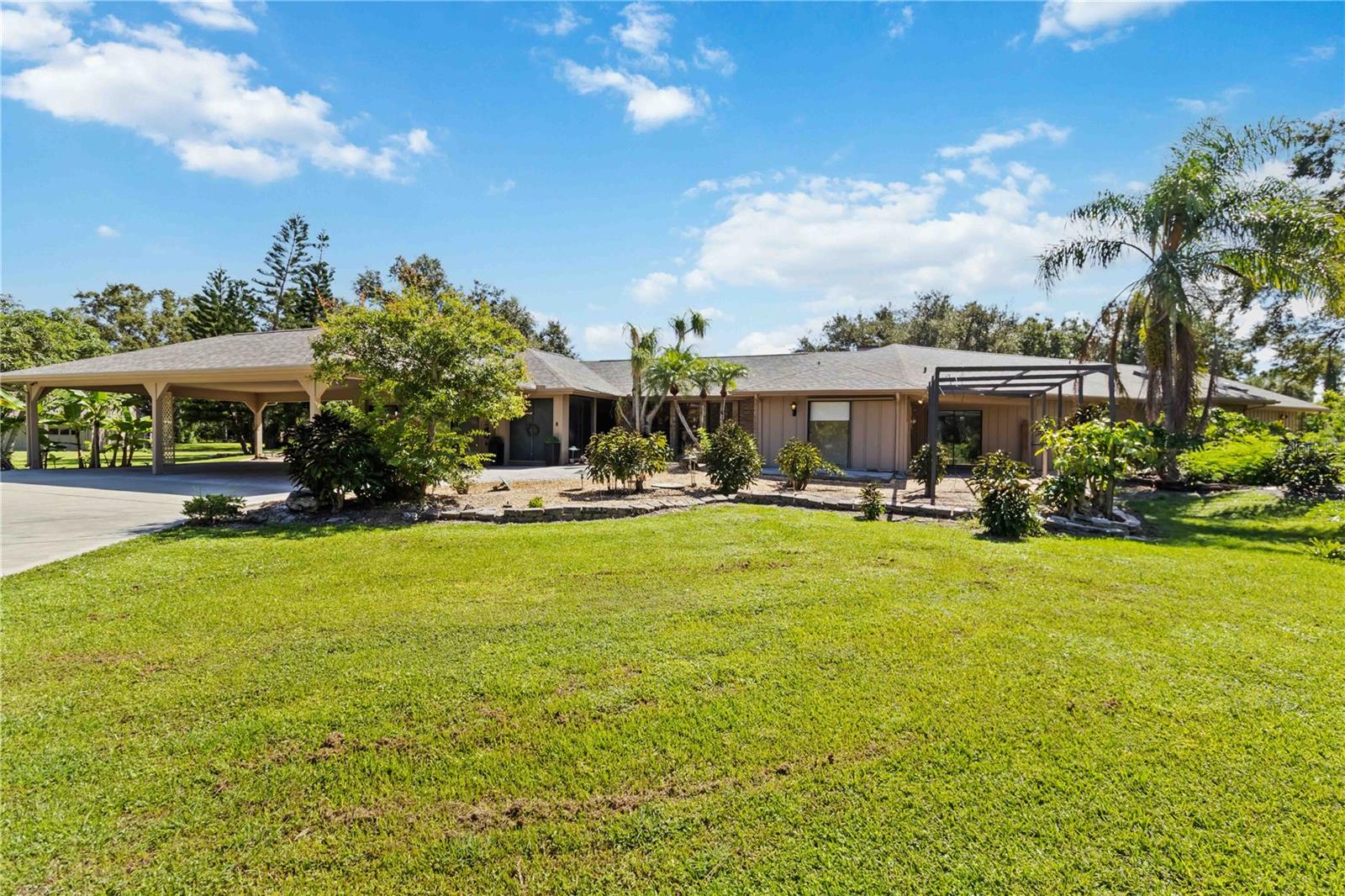 Located in the desirable Pine Ranch community, 701 Eaglenook Way offers 4 bedrooms, 4.5 bathrooms, and 3,533 sq ft of interior space. Set on 2.2 acres in a private, deed-restricted neighborhood where horses are permitted, this property provides generous space and functionality in a peaceful setting. A barn/garage outbuilding on the lot offers added flexibility for storage or other use.
A new roof and a recently built pool with a screened patio enclosure enhance the home’s exterior features. Additional outdoor highlights include a walkout gazebo overlooking a private pond and seven skylights throughout the home to bring in natural light.
Inside, the layout is both functional and versatile, with separate formal and family living areas. The property includes two primary bedroom suites: the second suite features a private living space, ensuite bathroom, vaulted ceilings, and two large walk-in closets. All four bedrooms have walk-in closets, and the main primary suite also includes an ensuite bathroom.
Extra features include two indoor wet bars and a third located on the pool patio. The converted two-car garage is air conditioned and can serve as an office, game room, or creative space. Two outbuildings are included: a barn/garage structure and a screened potting shed. The home also features tile flooring, a wood-burning fireplace in the family room, and a Florida room with sliding glass doors offering pond views. A circular driveway rounds out the exterior.
This home is near Legacy Trail, Pine View School, and shopping centers including Publix, offering convenience in a scenic setting.