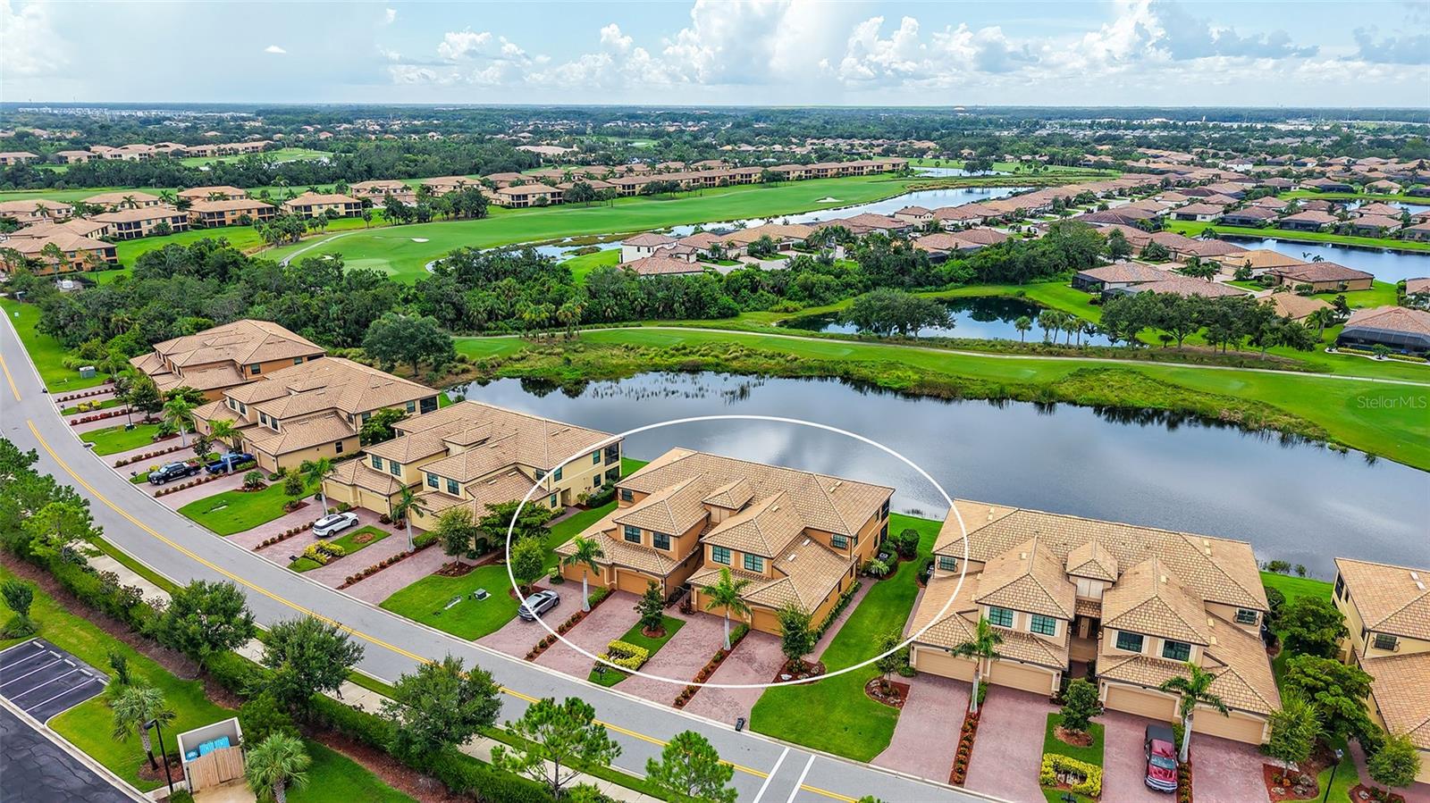 Welcome to this upstairs waterfront coach home, which is now ready for new owners. Located within the 24/7 manned gate guarded River Strand Golf and Country Club. This resort-style community offers easy living with beautiful scenery and access to world class amenities. This 2108 sq foot, 3-bedroom, 2 bathroom, second-floor Coach Home condo has a stunning view of the lake filled with wildlife and also the pristine golf course. The features such as: crown molding, solid wood cabinetry, granite countertops, and stainless-steel kitchen appliances, carpet and tile throughout the entire home, and a screened lanai for outdoor living. The open-concept kitchen, living, and dining areas, along with the 10 X 22 covered and screened-in lanai, and bay window off the breakfast nook, provide incredible views of the golf course and panoramic water views. The spacious owner's suite features a sliding door to lanai, dual sinks, separate tile shower, huge soaking tub, and dual walk-in closets, all of which creates a peaceful retreat. Located in a separate wing, both the second and third bedroom can also be used as an office, or flex space and shares a lovely full bathroom. The laundry is located in a separate room and is just the perfect size. This Oleander model includes a garage that actually has a tandem space to fit up to 3 cars or if you are handy, a workshop, or a golf cart. Before you enter the garage there is a huge storage space (under AC) which has been extended and is just perfect for holiday items, etc. This home offers the perfect blend of comfort, style, and leisure, making it an ideal place to call home or a possible snowbird opportunity. NOT a golfer? Great news! This coach home includes the Golf and Country Club SOCIAL membership with a 39,000-square-foot clubhouse that offers dining facilities in a semi-formal dining area, a grille room, and a Tiki bar. The clubhouse also has a fitness center, aerobics room, locker rooms, resort-style pool, resistance pool, heated spa, and six satellite pools strategically located throughout the community. The Sanctuary Clubhouse has a large pool as well and an area set aside for bingo, speakers, and private parties, along with a state-of-the-art 24/7 fitness center. There are multiple Pro Shops for golf and tennis, 9 Har-Tru clay tennis courts, 8 pickleball courts, and half-court basketball courts. This is an original owner. Call today for a showing.
