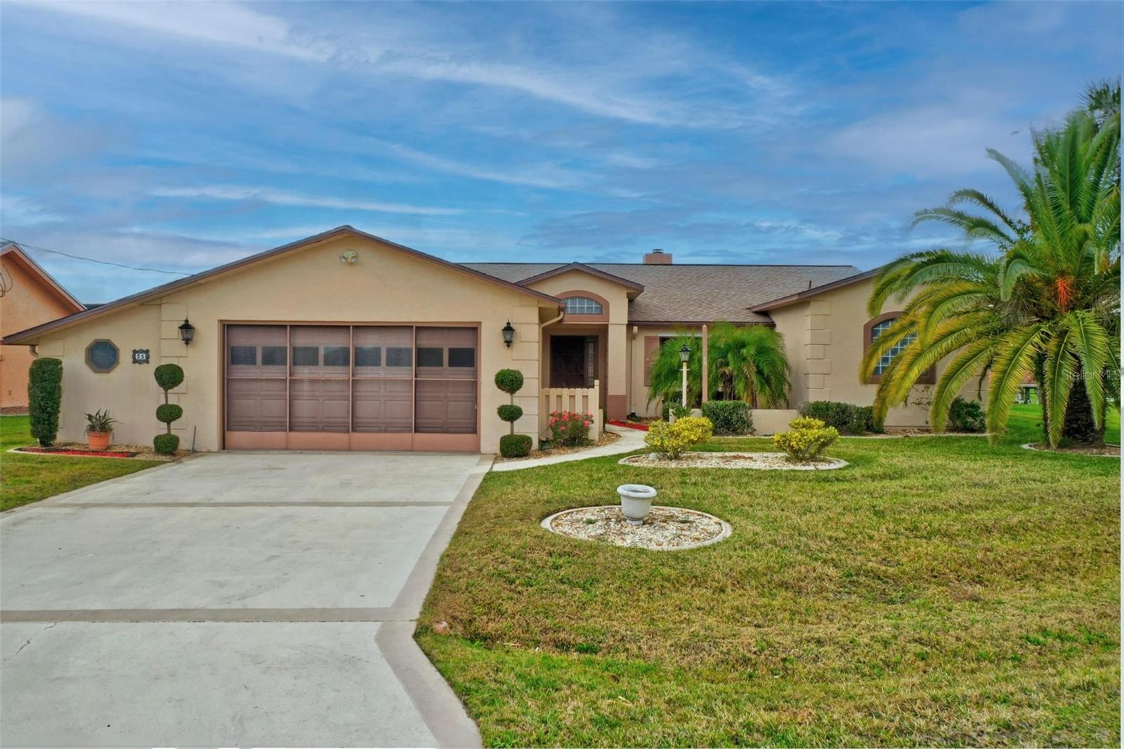 WATERFRONT!! This is the ultimate waterfront home with recently updated floors, interior paint and baths. Situated near the end of a beautiful cul-de-sac street with breathtaking saltwater canal views in the backyard. Just a few hundred yards from the Intracoastal Waterway with no fixed bridges along the way. There is a place for your boat in the 45-foot dock and boathouse with lift. Plenty of room to entertain on back porch overlooking canal. Home features over 2400sqft with a very large master suite with views of the water. The heart of the home is the fireplaced living room where you will host your large family gatherings. New roof 2022. Water heater 2019. HVAC 2011. Garage workshop. Hurricane Shutters. Don't miss this opportunity to secure your waterfront oasis in Sailboat country. Schedule your private showing today.