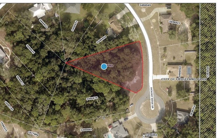 Beautiful wooded lot in Spring Lake Pines. Almost an acre near the cul-de-sac. Deed restrictions allow for Builder of your choice and no time frame to build in this peaceful neighborhood. Located convenient to shopping, medical, business and entertainment in The Villages. Come build your dream home here.
