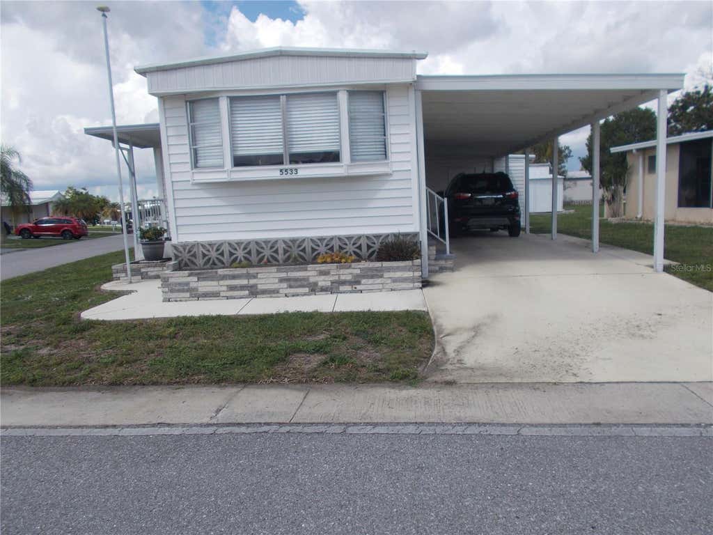 Photo of 5533 Holiday Park Boulevard, North Port, FL 34287 (MLS # C7528010)