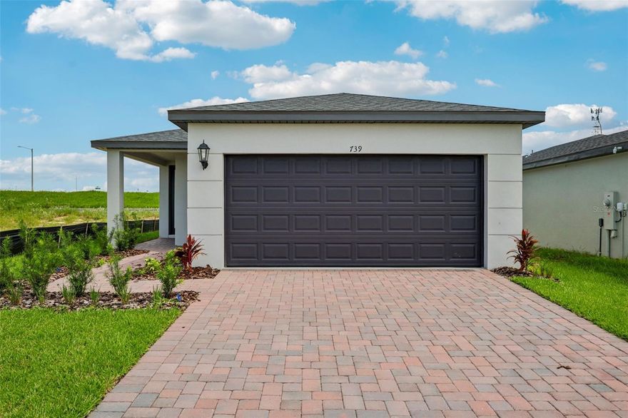 One or more photo(s) has been virtually staged. Welcome to your dream home in the highly desirable Hamilton Bluffs community,
located in Lake Hamilton near Hwy 27—a prime Central Florida location with easy
access to Port 27, shopping, dining, and recreation.
This brand-new, single-story home offers 4 spacious bedrooms, 2 full bathrooms, and a
2-car garage, all thoughtfully designed for comfort, style, and energy efficiency.
Interior Features:
• Grey cabinets with crown molding for a modern, upscale touch
• Granite countertops in both kitchen and bathrooms
• Tile flooring throughout all living areas for durability and easy maintenance
• Carpeted bedrooms for warmth and comfort
• Stainless steel kitchen appliances included: refrigerator, range, microwave, and
dishwasher
• Washer, dryer, and blinds all included—just bring your furniture!
Open Concept Living:
• Kitchen island with counter-height bar seating flows into the dining and family
room
• Panoramic view from the kitchen sink to the backyard and living spaces—perfect
for entertaining and keeping an eye on loved ones
Energy Efficiency &amp; Wellness:
• Energy Star Certified with spray foam insulation and fresh air intake system
• Designed to reduce allergens, improve indoor air quality, and lower utility bills
• Enjoy a quieter, healthier home environment
Community Highlights:
• Multi-phase development with future growth potential
• Resort-style amenities: community pool, playground, and open green spaces
• Close to Port 27, Lake Hamilton’s scenic beauty, and outdoor activities
• Cell tower on site for enhanced connectivity

Whether you&#39;re a first-time buyer, downsizing, or investing in Florida real estate, this
MOVE-IN READY home offers unbeatable value, lifestyle, and location.