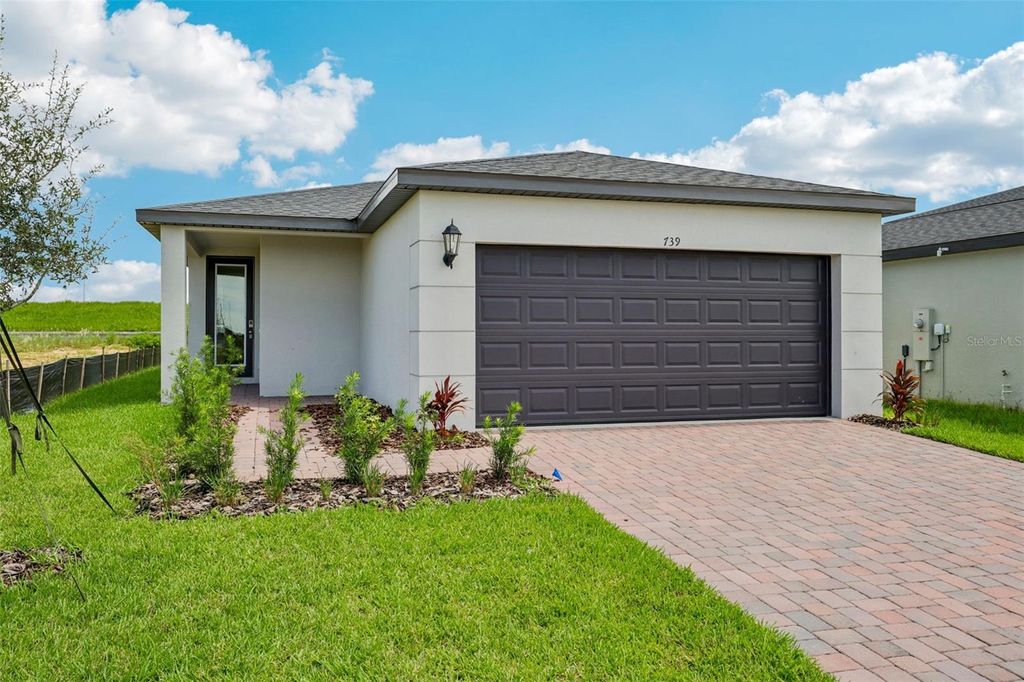 Photo of 739 Trailhead Pt Drive, Haines City, FL 33844 (MLS # O6356742)