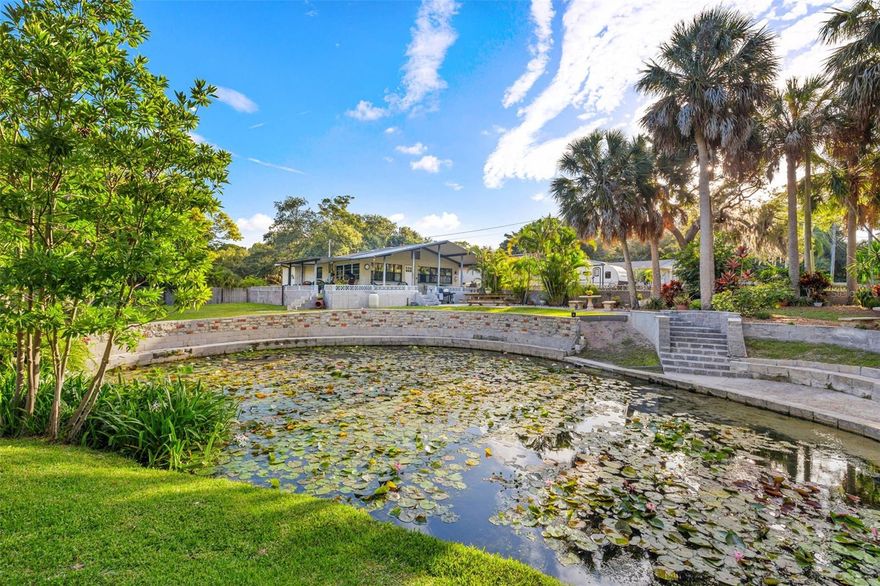 LARGO NATURAL SPRING DREAM PROPERTY! Welcome to endless possibilities! Ever dream of having an
urban farm? Dream of having your own personal spring and pond? Want space to play, plant your garden, grow vegetables or just love the open space? Welcome to 14755 Pine Dr! This property is unique in so many ways. Boasting over 1.4 Acres of land, a Natural
Spring, and two buildings let your imagination run wild! The main house is 1180 sq ft with a massive
living and dining area, kitchen, half bath with access to the wrap around porch, office, and master
bedroom and ensuite bath. The second building is 660 sq ft of living space and has two bedrooms, full
bath and living room. This building is attached to the oversized two car garage with extra workspace
and storage. The generous driveway can accommodate your toys, campers, trailers, etc. This property
is a MUST see! As you stroll towards the front door your eyes can’t help but take in the expansive yard,
and the spring. The spring head is located by the pond and releases more than 1,000,000 gallons of water
daily! (This a 3rd magnitude producing spring.) At a cool 72 degrees the spring head flows into the pond area that is teeming with life, from fish, turtles, otters, and birds, this old Florida tropical paradise is a must see! From the pond the freshwater
flows through the property and ultimately joins the Gulf of Mexico! The main house has an expansive
porch area that wraps the home. Imagine yourself, cup of coffee in hand, curled up on a porch
swing watching the day unfold in your own private paradise! Sunsets and cool breezes welcome the end
of a day again on your porch while the sky provides an endless canvas of change and color. This
property is just moments from the sugar sand beaches of Pinellas County and close to shopping, dining,
entertainment, and all that Pinellas has to offer. No flood insurance required! Roof one 2002, roof two
2004, roof three 2021, HVAV 2017, Hot water heater 2020, Impact Windows 2012, Replumbed entire home 2013.