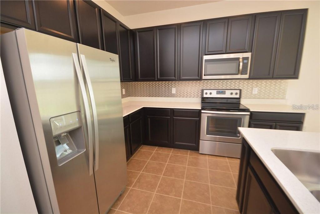 Photo of 116 Seville Drive, Davenport, FL 33837 (MLS # TB8491359)