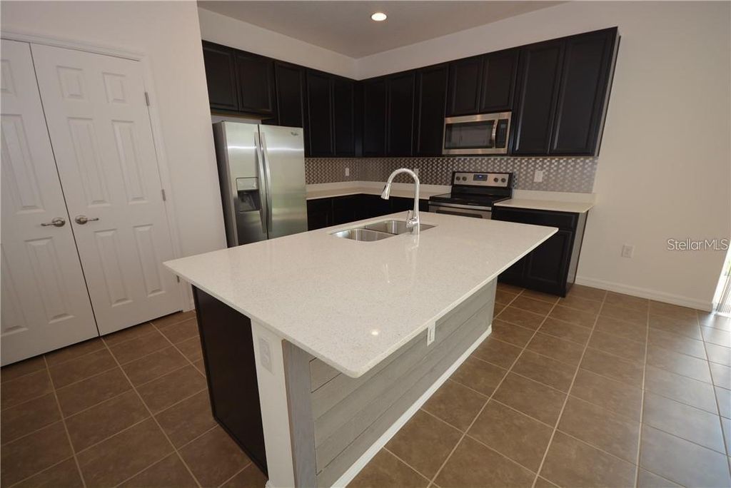 Photo of 116 Seville Drive, Davenport, FL 33837 (MLS # TB8491359)