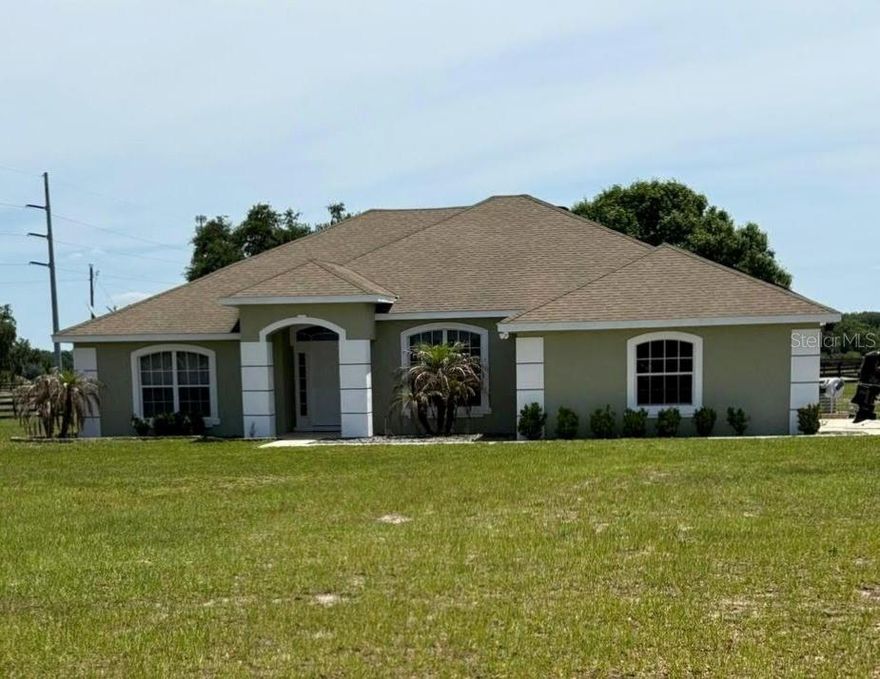 Welcome to your new home!  Do you work from home?  Then this place is perfect!  With a 16x13 den that gives you plenty of room to spread out.  This beautiful 3 bedroom, 2 bath home is waiting for you.  Complete with an electric fireplace for those cold Florida winter nights, you can cozy up by the fire.  HUGE oversize garage and a 24x40 pole barn to store all your toys.  There's also a lean-to that is 15x40 for storage.  All of this can be yours on 4.6 acres of property.  Plenty of room to add a pool and a backyard oasis!