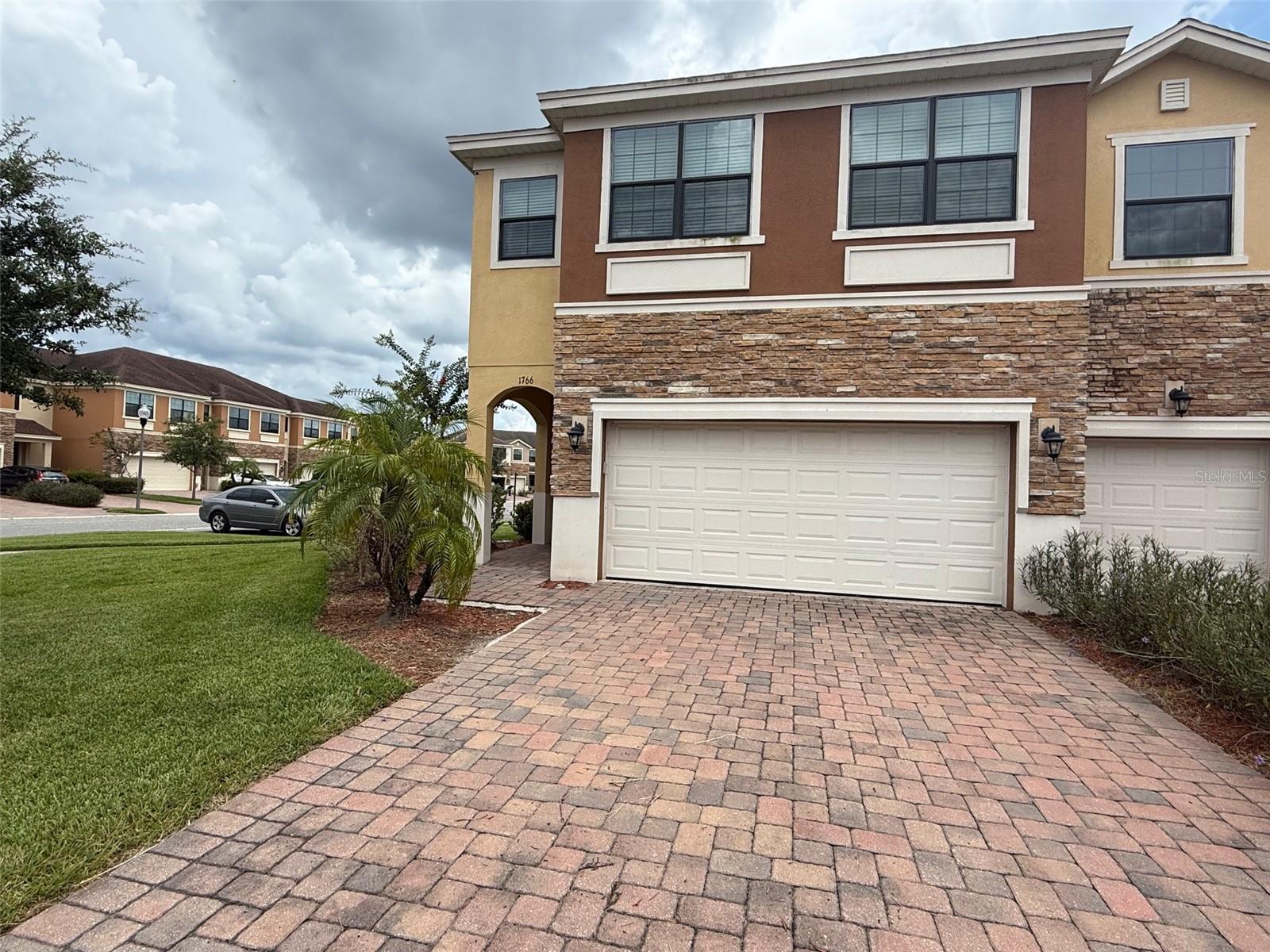 Step into comfort and convenience at 1766 Portofino Meadows Blvd, a beautifully maintained townhome nestled in a gated community in South East Orlando. This spacious 4-bedroom, 2.5-bath residence features an open-concept layout with sleek tile flooring, a modern kitchen with granite countertops and stainless steel appliances, and a private patio perfect for relaxing or entertaining. Upstairs, the generous primary suite offers a walk-in closet and en-suite bath, while two additional bedrooms provide flexibility for guests or a home office. Enjoy the ease of attached garage parking and the peace of mind that comes with living in a secure, well-kept neighborhood. Located just minutes from major highways, shopping, dining, and the Orlando International Airport, this home offers the perfect blend of tranquility and accessibility. Up to 3 small pets allowed with pet fees. No smoking allowed.