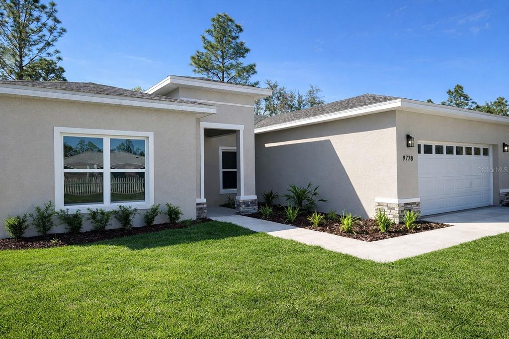 Photo of 9778 N Chapel Way, Citrus Springs, FL 34433 (MLS # O6392212)