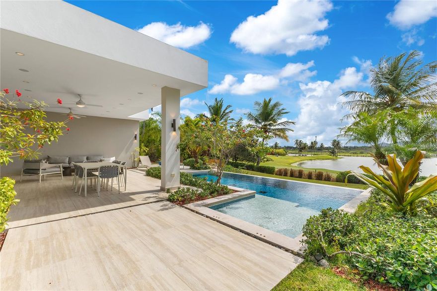Come and experience living in Enclave, one of the most exclusive communities in the coveted Dorado Beach Resort, this stunning one-story residence offers an unparalleled blend of luxury, comfort, and breathtaking views. Spanning 3,453 sqft. of elegantly designed, conditioned living space on a 1,227 sqmt. lot, this 4-bedroom, 4-bath, and 2 half-bath home is a true sanctuary. All bedrooms have en-suite bathrooms great for privacy. The open-concept layout and soaring ceilings in the living area create a sense of spaciousness, enhanced by an abundance of natural light.

Enjoy serene lake and golf course views from the covered terrace and private pool—perfect for outdoor entertaining. The modern kitchen offers ample storage and panoramic views of the lake. The master suite is a tranquil retreat with direct backyard access, a spacious walk-in closet, and a spa-like master bath featuring dual showers, a soaking tub, and an outdoor shower for a resort-style experience.

Dorado Beach Resort and Club offers access to a wide range of world-class amenities, including the Sports Hub, Fitness & Wellness Center, Tennis Center, and a variety of restaurants. Enjoy the convenience of being close to everything you need for a comfortable and vibrant lifestyle.