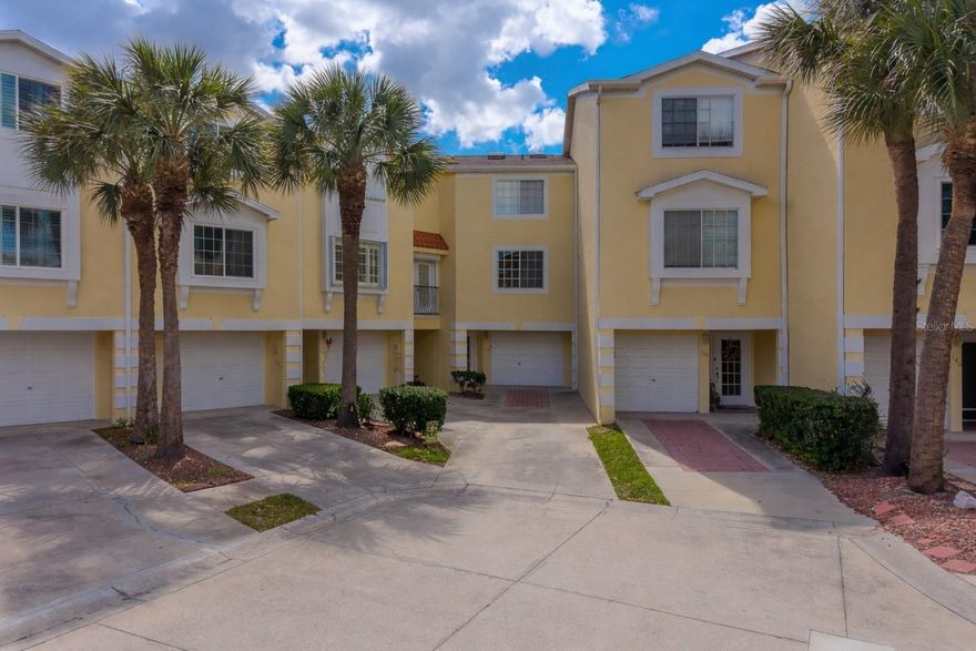 Welcome to 138 Brent Circle in desirable gated Seaside Estates—an exceptional opportunity to own the largest corner townhome in this sought-after waterfront community in Oldsmar. Perfectly positioned to capture panoramic views of Tampa Bay, this residence offers a rare combination of space, scenery, and coastal lifestyle, complete with a private boat slip for easy access to the water. This spacious 4-bedroom, 3-bath home features a thoughtfully designed layout with abundant natural light and comfortable living areas ideal for both everyday living and entertaining. The inviting living room is anchored by a cozy fireplace, creating a warm focal point while showcasing the stunning water views beyond. A second fireplace in the primary bedroom adds an extra layer of comfort and charm, creating a relaxing private retreat. The kitchen offers ample cabinetry and workspace, seamlessly connecting to the dining and living areas for a functional, open feel. Each bedroom provides flexibility for a variety of living arrangements, while the three full bathrooms add convenience and comfort. An oversized garage delivers generous storage and parking space—an added benefit rarely found in townhome living. As a corner unit, the home enjoys enhanced privacy and additional natural light. Step outside and take in the tranquil waterfront setting, where you can relax, entertain, or set out for a day on Tampa Bay directly from your own boat slip. Conveniently located near parks, shopping, dining, and major roadways, this property offers the perfect blend of peaceful coastal living and everyday accessibility. Don’t miss your chance to own a premier waterfront residence in Seaside Estates—schedule your private showing today.