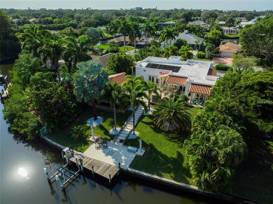 Looking for the perfect rental property? Look no further than this remodeled Waterfront canal front 3 bed 3 1/2 bath home with bay access! Situated in a large fenced lot, this stunning luxurious home boasts a large Coral stone outdoor patio with elevated kitchen, bar and fireplace wrapped around an inviting saltwater heated pool. Impeccably furnished throughout with upscale European finishes complimenting the open chef's kitchen with natural stone counters, French solid wood cabinetry, stainless appliances with a separate Butler's pantry with a brand new floor to ceiling wine refrigerator! You are sure to be safe with the latest video surveilance technology and high-end doors and windows built to current hurricane codes. This home is a pleasure to show and hear as it sports surround sound with speakers throughout which will serenade you througought your stay. This prime location is within 5 minutes to Siesta Beach, 10 minutes to downtown Sarasota and I-75. 90 + dock. Check out this rarity today!