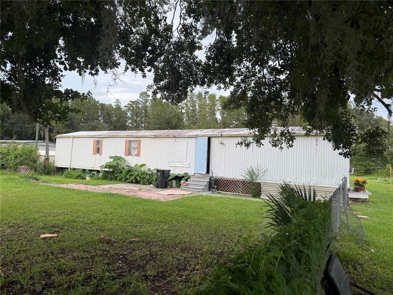 1.91 Acres priced for a quick sale! The manufactured home on the property needs repair or removal. A large lot of 1.91 acres has lots of potential.