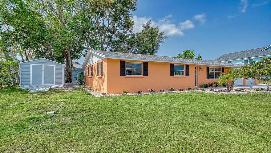SARASOTA COUNTY...Discover the serene beauty of SHAKETT CREEK with this exceptional waterfront property. Boasting an impressive 236 feet of direct access to saltwater canals. The property is situated near the Gulf/Ocean and Intracoastal Waterway, providing a perfect blend of tranquility and recreational activities. You'll have a hard time deciding whether to grill on the deck, go semi-pro in the spacious kitchen, or enjoy dinner in town. You can sit on the back porch, which is screened for privacy, or the open air porch, all options are open. This is a great place to be, well positioned on a quiet no-thruway street, the home is only minutes to outdoor recreational opportunities, dining and shopping. You'll enjoy impressive views of Intracoastal Waterway/Canal while you sit on the dock fishing or bringing your kayak/jet skis/boat for water adventures. Attractive landscaping maximizes the value of the expansive yard.  Your outdoor furniture transforms the inviting patio into an extension of the home, ideal for sunset dinners and starry nightcaps. There is also an added bonus of an air conditioned shed, for the kids, grandkids or to go read a good book while looking at the view or the water. The ensuite primary bedroom, (king bed) conveniently located on the main-floor, is well-designed and peaceful along with a custom built closet. The other 2 bedrooms, (queen and a pullout)unique and quiet, also offer the convenience of ground floor accessibility. Have fun packing this one full of warmth and memories. Call today and enjoy the stunning water views and the vibrant natural surroundings that make this area so desirable.