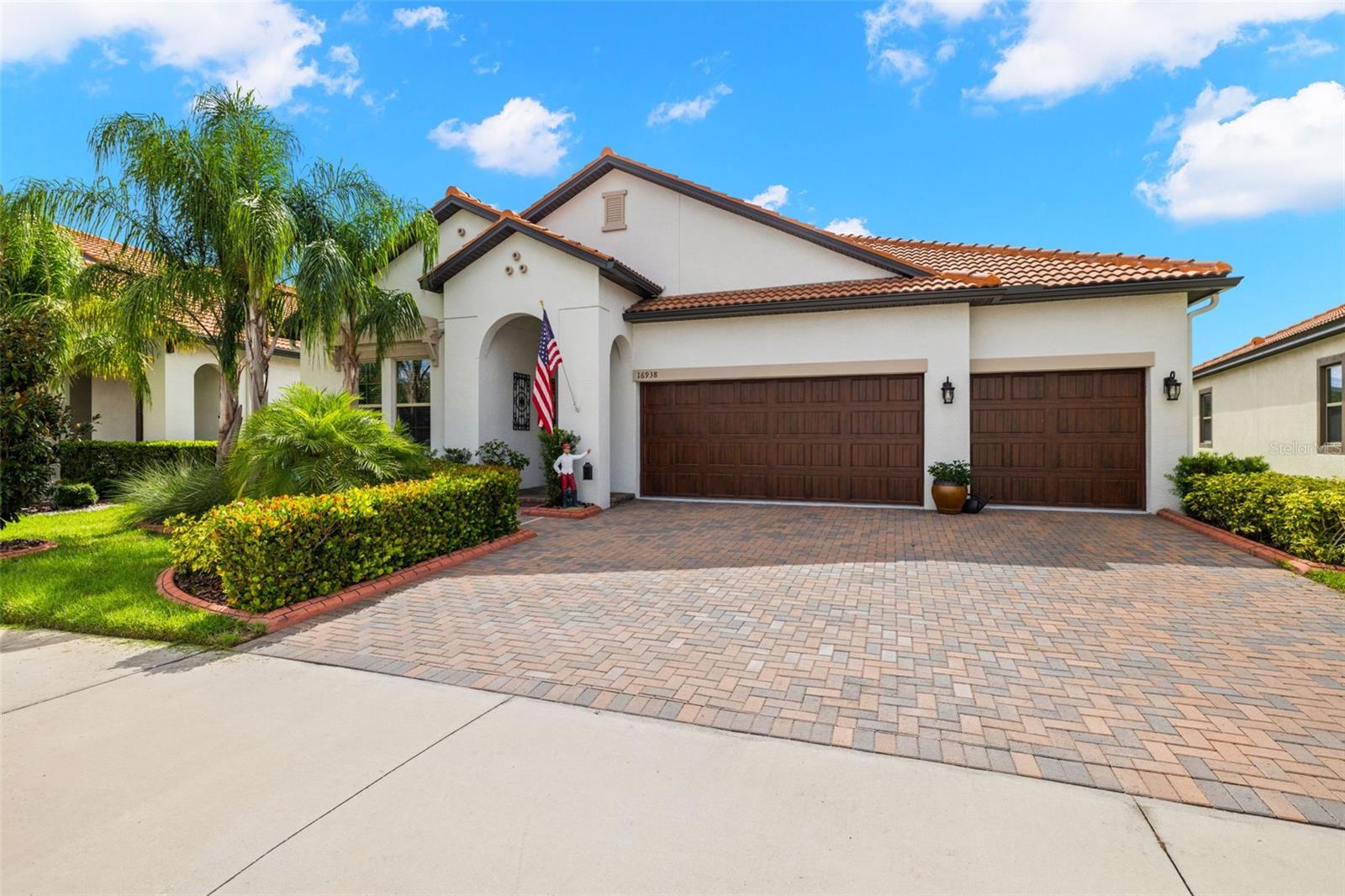 16938 Scuba Crest Dr is an exceptional property nestled within the popular LAGOON Southshore Bay gated community in Wimauma, FL, offering a blend of luxurious living and modern convenience. This immaculately maintained home features 3 bedrooms and 3.5 bathrooms, boasting a spacious layout complemented by upscale finishes and meticulous attention to detail. Upon entering, guests are greeted by a professionally staged interior, meticulously decorated by an interior designer. Among the upscale finishes are carefully selected custom window treatments, blinds, motorized shades, and stylish furniture. One of the standout features of this property is its exclusive private heated pool and spa, a rare find within the community. The pool and spa can be conveniently controlled remotely via smartphone, allowing for effortless enjoyment and relaxation. For practicality and comfort, the home is equipped with a comprehensive water softener and filtration system, ensuring high-quality water throughout the entire residence. The garage includes a dedicated 110 VAC outlet compatible with plug-in EV chargers, reflecting a commitment to modern amenities. Additional storage in the attic space above the garage offers flexibility, potentially transforming into a private office or maintaining it as a convenient storage solution. Each bedroom in the home features its own en suite bathroom, offering unparalleled convenience and privacy for residents and guests alike. The modern kitchen features upgraded appliances, cabinets with roll-out shelving, a butler's pantry and a large walk in pantry with added shelving. Located in the desirable Southshore Bay community, residents enjoy access to resort-style amenities, including a clubhouse, fitness center, 5 acre lagoon with water slides, and recreational facilities, all set against the backdrop of Wimauma's natural beauty. This property represents an extraordinary opportunity to embrace luxury living in a vibrant and welcoming community.
