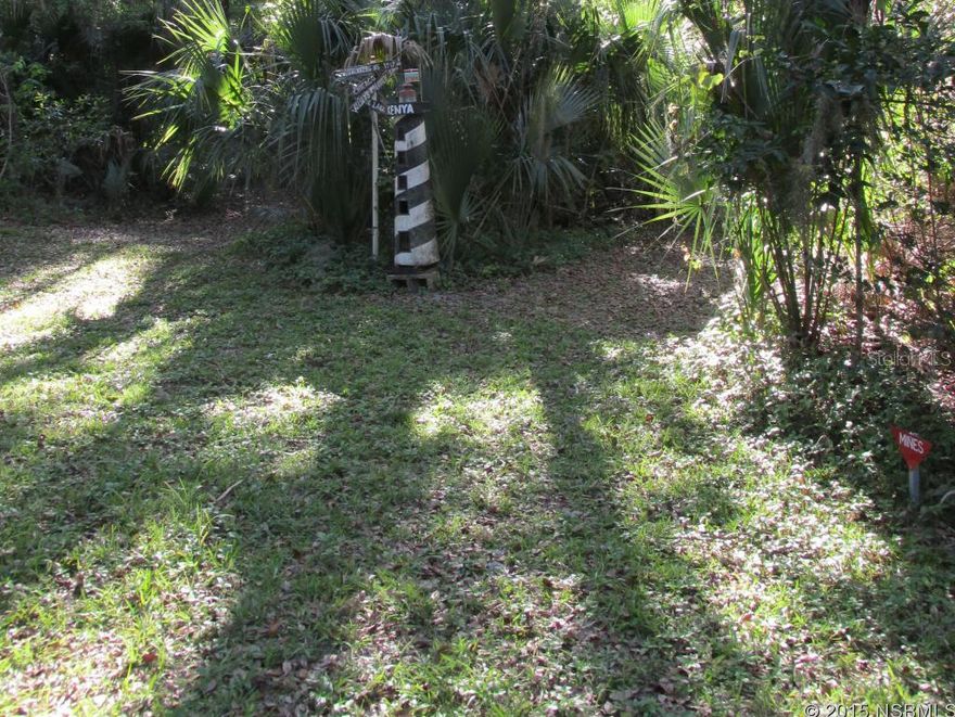 Five and a half acres of pristine hardwood hammock with trails and paths meandering throughout.  Ancient oak trees, natural savanna and beautiful old Florida fauna.  Property can be sub-divided for individual development or kept as a secluded parcel.; Cleared: No ;Water: Holding Tank