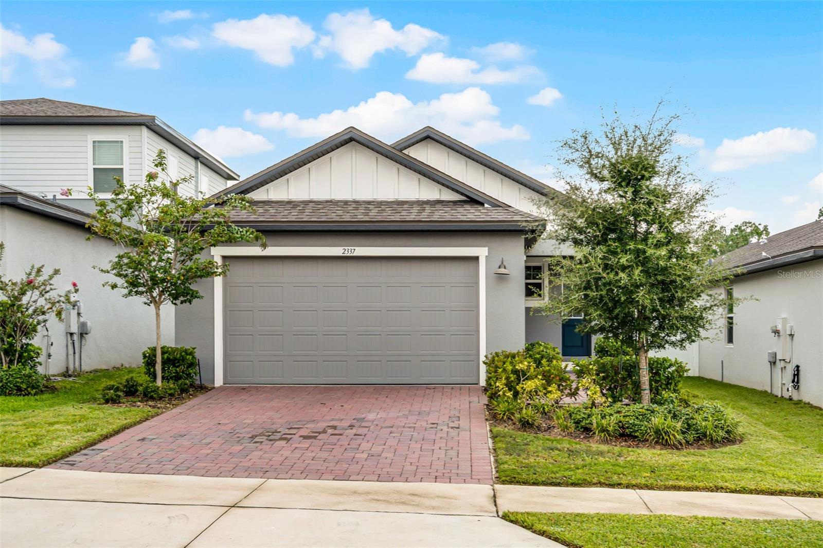 Your search ends here! This 3 bedroom, 2 bathroom Minneola home delivers 1,502 sq ft of beautifully designed space and the perfect balance of indoor and outdoor living. The curb appeal shines with a manicured front lawn and charming brick driveway, setting the tone for what awaits inside. Step into an open-concept layout where the living room, dining room, and kitchen flow seamlessly together, enhanced by recessed lighting and contemporary finishes. The kitchen is equipped with stainless steel appliances, a breakfast bar, and plenty of space to prepare meals while staying connected with family and guests. Each bedroom is filled with natural light and generous storage, ensuring everyone feels at home, while the primary suite offers a private retreat with dual sinks, a spacious shower, and a walk-in closet. Outdoor living is just as inviting with a covered patio perfect for al fresco dining in the warm Florida weather and a fully fenced backyard where little ones and four legged can play freely. Enjoy community amenities including a park, playground, and pool, or explore the nearby lakes, nature trails, and charming downtown areas of Minneola and Clermont. With easy access to the Florida Turnpike, top-rated schools, and world-class attractions like Disney and Universal just 30 minutes away, this home blends everyday convenience with the best of Central Florida living. Don’t miss your chance to call this stunning property your new home, schedule a private showing TODAY!!!