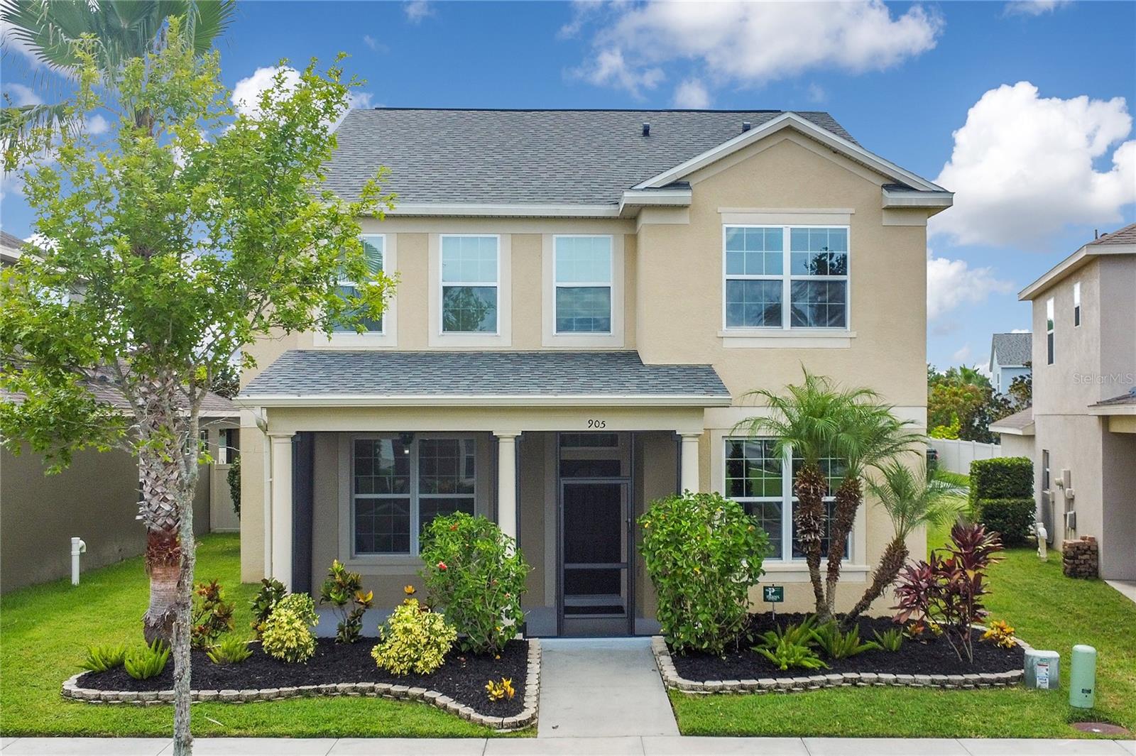Welcome to this stunning four-bedroom, three-bath home in the lakeside luxury community of Waterside Pointe in Groveland, FL—ideally situated on the Clermont Chain of Lakes. Built in 2014 and in like-new condition, this spacious, approximately 2,536 square foot home offers a flexible loft space (easily converted to a fifth bedroom), a formal living room, a family room, and a bright, open kitchen with an island. Enjoy NO CARPET, generously-sized bedrooms, and a convenient first-floor bedroom, bathroom, laundry room, and screened front porch. Upstairs, the primary suite hosts a large walk-in closet and is tucked in a corner away from the other rooms. Venture outside to your covered, screened patio, extended open patio (great for barbecuing, basketball, or skating), and fully fenced backyard with irrigation.
A new roof was added in 2025 and includes a transferable warranty. Waterside Pointe offers resort-style amenities including a pool with water slide, fitness center, tennis/pickleball and basketball courts, sports field, playgrounds, scenic views, and a 3.2-mile lakefront walking loop. The gated, pet-friendly community features a private boat ramp, interior lake access, boat storage, and a dock to the Chain of Lakes. Close to shopping, schools, medical facilities, and more!
