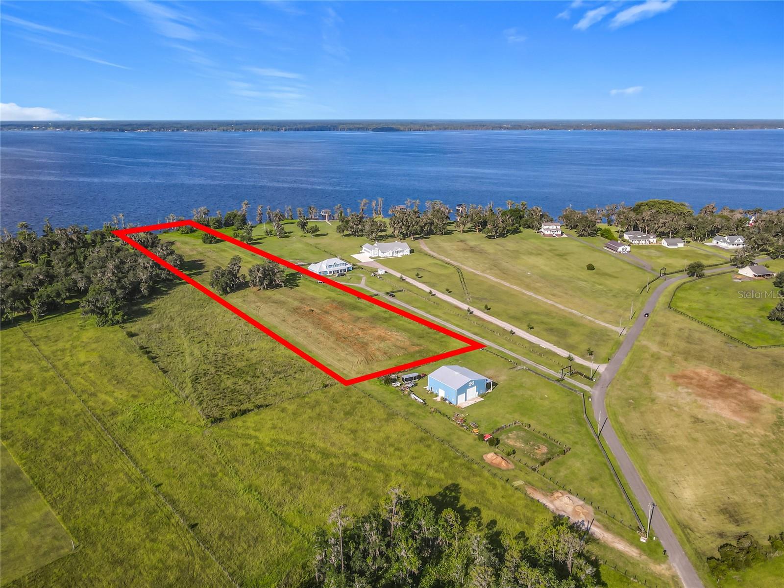 6.1 ACRE LOT!!! Located on one of the 10 largest lakes in Florida—CRESCENT LAKE—this exceptional parcel lies within the PRIVATE, GATED, WATERFRONT, EQUESTRIAN COMMUNITY of ANDALUSIA BAY. The community features 24 unique five-to-ten-acre homesites, each with one's own access to Crescent Lake and NAVIGABLE WATER TO THE ST. JOHN'S RIVER.
This HOMESITE—LOT 19, boasts 200 FEET of PRIME LAKE FRONTAGE, offering a rare opportunity to enjoy a unique lifestyle that blends natural beauty with upscale country living. Boating enthusiasts will love the lake’s pristine waters, ideal for leisurely cruises, thrilling water sports, kayaking, paddleboarding, and some of Florida’s best bass fishing—some of which you can enjoy right from the lakeshore where you can BUILD YOUR PRIVATE DOCK.
There is ample room to embrace the charm of country living—whether it’s the joy of gardening, outdoor activities, pet parenting, or, for horse lovers, building a barn, stable, and paddocks in the generous open space.
Conveniently located approximately 25 to 30 minutes from shopping, Flagler Beach, and just northward to the St. Johns Equestrian Center, Andalusia Bay offers both privacy and accessibility.
From the secluded, magnificent surroundings, you’ll EXPERIENCE BREATHTAKING SUNRISES AND SUNSETS—showcasing the perfect place to BUILD YOUR FOREVER HOME.
Homesite cleared. Builder of your choice. No restrictions on time frame for building.