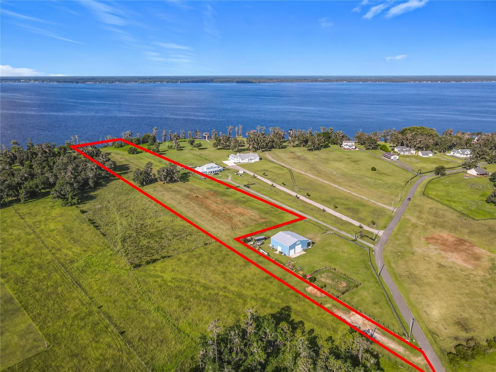 6.1 ACRE LOT!!! Located on one of the 10 largest lakes in Florida—CRESCENT LAKE—this exceptional parcel lies within the PRIVATE, GATED, WATERFRONT, EQUESTRIAN COMMUNITY of ANDALUSIA BAY. The community features 24 unique five-to-ten-acre homesites, each with one's own access to Crescent Lake and NAVIGABLE WATER TO THE ST. JOHN'S RIVER.
This HOMESITE—LOT 19, boasts 200 FEET of PRIME LAKE FRONTAGE, offering a rare opportunity to enjoy a unique lifestyle that blends natural beauty with upscale country living. Boating enthusiasts will love the lake’s pristine waters, ideal for leisurely cruises, thrilling water sports, kayaking, paddleboarding, and some of Florida’s best bass fishing—some of which you can enjoy right from the lakeshore where you can BUILD YOUR PRIVATE DOCK.
There is ample room to embrace the charm of country living—whether it’s the joy of gardening, outdoor activities, pet parenting, or, for horse lovers, building a barn, stable, and paddocks in the generous open space.
Conveniently located approximately 25 to 30 minutes from shopping, Flagler Beach, and just northward to the St. Johns Equestrian Center, Andalusia Bay offers both privacy and accessibility.
From the secluded, magnificent surroundings, you’ll EXPERIENCE BREATHTAKING SUNRISES AND SUNSETS—showcasing the perfect place to BUILD YOUR FOREVER HOME.
Homesite cleared. Builder of your choice. No restrictions on time frame for building.