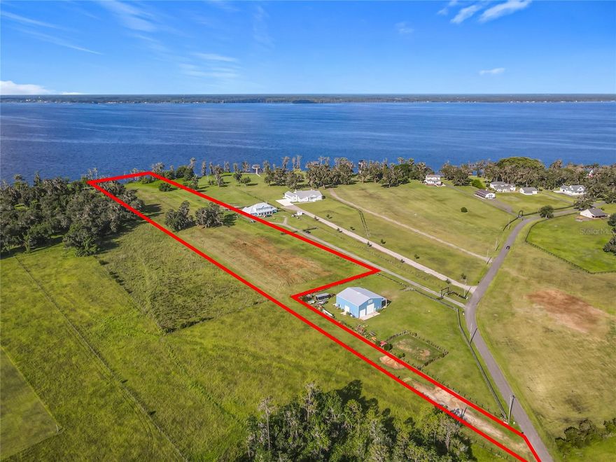 6.1 ACRE LOT!!! Located on one of the 10 largest lakes in Florida—CRESCENT LAKE—this exceptional parcel lies within the PRIVATE, GATED, WATERFRONT, EQUESTRIAN COMMUNITY of ANDALUSIA BAY. The community features 24 unique five-to-ten-acre homesites, each with one's own access to Crescent Lake and NAVIGABLE WATER TO THE ST. JOHN'S RIVER.

This HOMESITE—LOT 19, boasts 200 FEET of PRIME LAKE FRONTAGE, offering a rare opportunity to enjoy a unique lifestyle that blends natural beauty with upscale country living. Boating enthusiasts will love the lake’s pristine waters, ideal for leisurely cruises, thrilling water sports, kayaking, paddleboarding, and some of Florida’s best bass fishing—some of which you can enjoy right from the lakeshore where you can BUILD YOUR PRIVATE DOCK.

There is ample room to embrace the charm of country living—whether it’s the joy of gardening, outdoor activities, pet parenting, or, for horse lovers, building a barn, stable, and paddocks in the generous open space.

Conveniently located approximately 25 to 30 minutes from shopping, Flagler Beach, and just northward to the St. Johns Equestrian Center, Andalusia Bay offers both privacy and accessibility.

From the secluded, magnificent surroundings, you’ll EXPERIENCE BREATHTAKING SUNRISES AND SUNSETS—showcasing the perfect place to BUILD YOUR FOREVER HOME.

Homesite cleared. Builder of your choice. No restrictions on time frame for building.